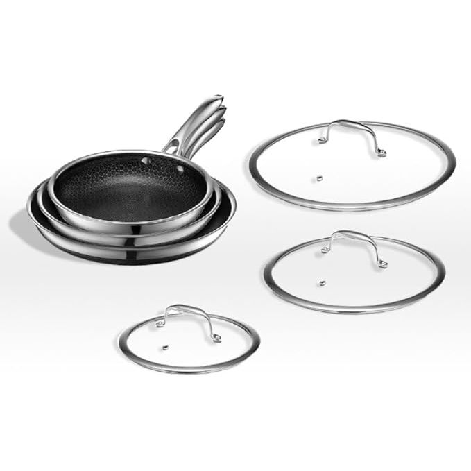 The HexClad Hybrid Nonstick Fry Pan Set includes three pans in varying sizes - 8, 10, and 12 inches - each equipped with a tempered glass lid. The pans feature a unique combination of stainless steel and nonstick surfaces, making them durable and versatile for all types of cooking.