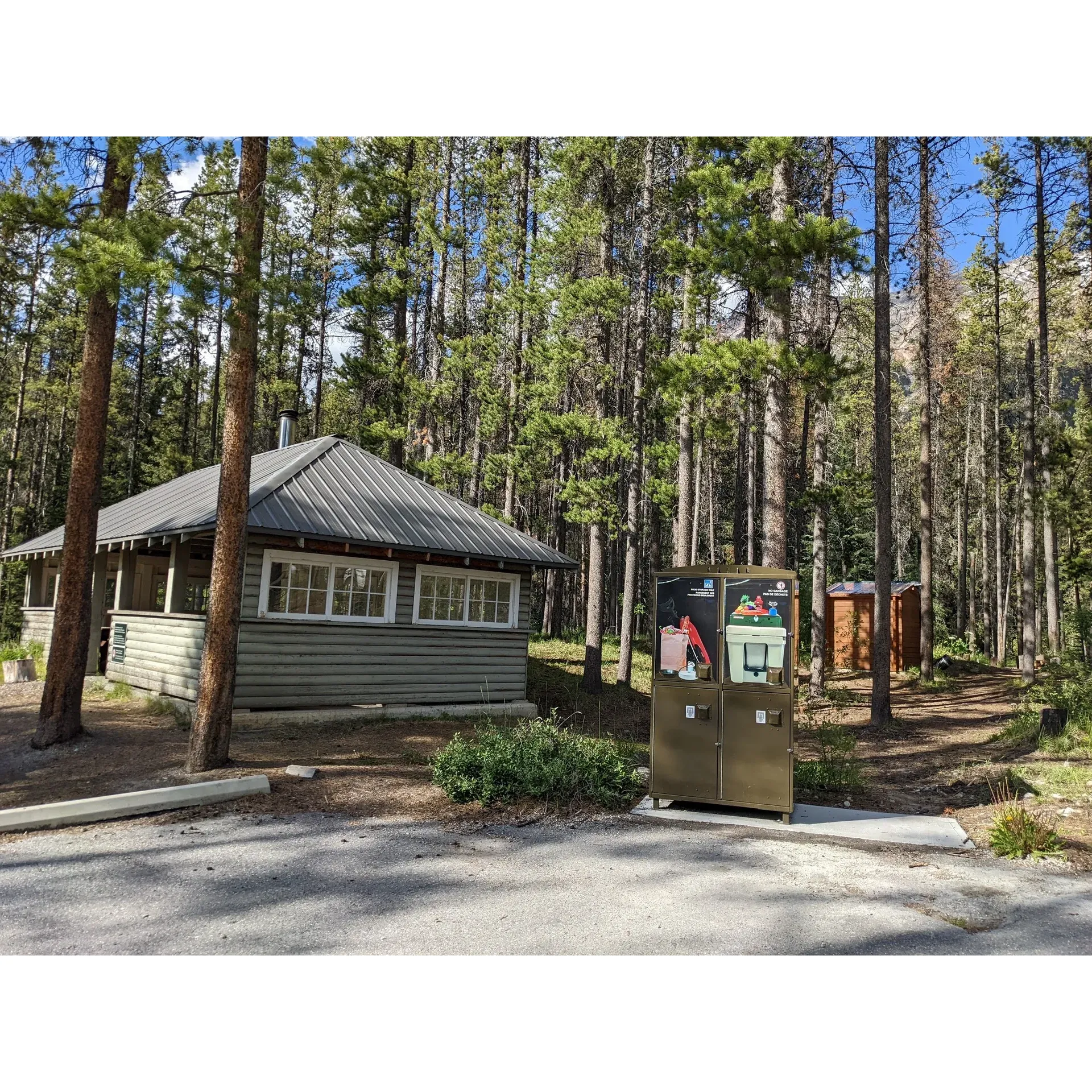 At Jonas Creek Campground in the majestic Jasper National Park, Alberta, Canada, visitors are invited to embrace the serene beauty of the great outdoors. This beautifully maintained federal Park Canada destination offers a tranquil retreat for campers arriving with tents or motorhomes, accommodating vehicles up to 25 feet in length. Appreciated for its cleanliness and orderly facilities, the campground operates on a convenient self-service, first-come, first-served basis, ensuring a fair opportunity for all nature enthusiasts to secure their spot.

Surrounded by a lush canopy of trees and bordered by the gentle murmurs of a nearby small river, Jonas Creek Campground is an idyllic oasis that belies its proximity to the highway, providing a peaceful environment that few can resist. The campground is a favorite among guests who are charmed by its simple yet picturesque setting.

Practical amenities contribute to the comfort of your stay, including potable drinking water and food storage bear boxes to keep your provisions safe. Cook shelters offer a shared space for meal preparations, while clean drop toilets are conveniently located throughout the site. Notably, the inclusive camping fee comes with an added perk – complimentary firewood, perfect for those memorable evenings under the stars, complete with the crackling sound of a warm campfire.

Cyclists, in particular, find Jonas Creek Campground to be a perfect stopover, offering a restful haven before continuing on their journey through awe-inspiring landscapes, including the unforgettable ride past the Icefields. Whether you're passing through or planning to stay and immerse yourself in the beauty of Jasper National Park, Jonas Creek Campground is a place that captivates the heart, beckoning visitors to return time and again to this little slice of Canadian wilderness paradise. Description by ChatGPT.