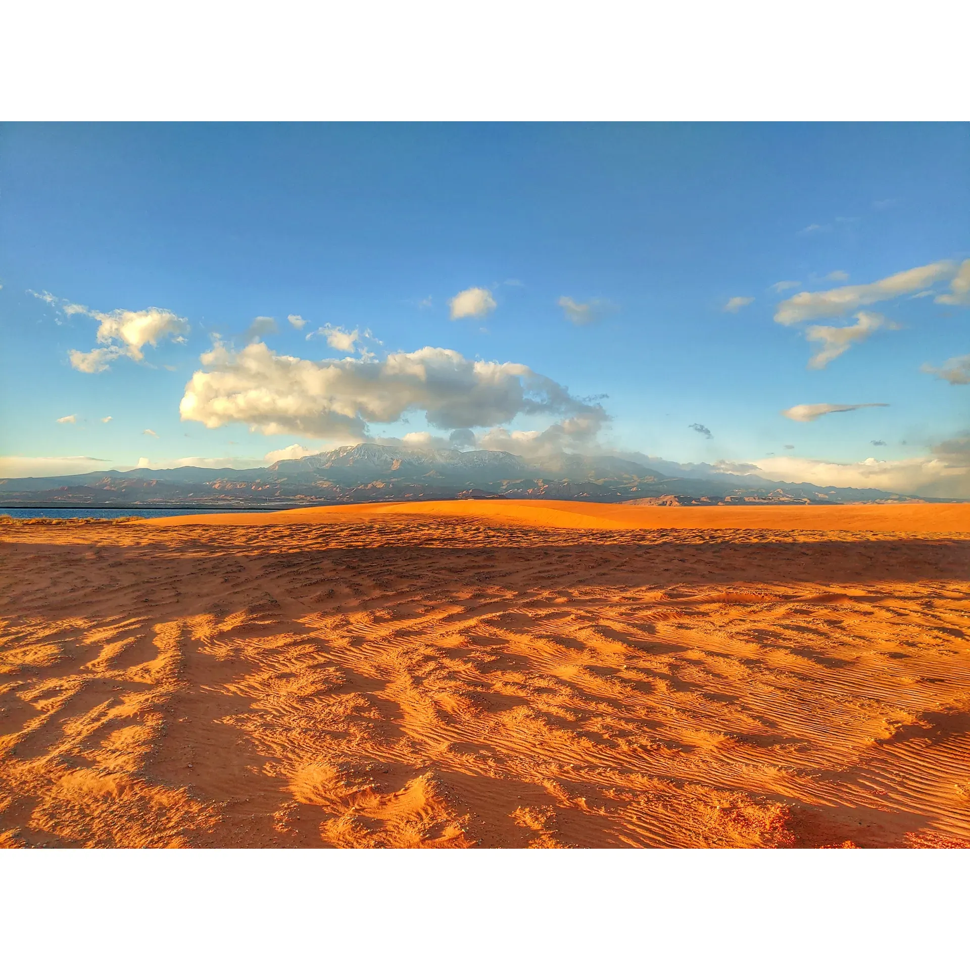 Sandpit Campground is an enthusiast's haven for off-highway vehicle (OHV) aficionados, surrounded by the majestic scenery synonymous with adventure and exploration. Boasting close proximity to vast sand dunes and a picturesque beach just across the road, this campground is the ultimate base for thrill-seekers looking to immerse themselves in outdoor activities, from pink sand escapades to navigating Moab-style rocks.

The diverse campground offers a wide range of spacious sites to accommodate your vehicles and trailers, with a selection of both hook-up and non-hook-up options to suit various preferences. Facilities include convenient restrooms, showers, and dumpsters, ensuring a comfortable stay for all. A nearby dump station further adds to the practical amenities of the park.

Culinary needs are also met within the grounds, thanks to an on-site vendor serving scrumptious burgers alongside rental services and essential supplies. For those seeking a memorable dining experience, a local golf course clubhouse nearby offers delightful meals to complement the campground's energetic atmosphere.

Camaraderie flourishes here, with a camp host eager to assist guests in adhering to the campground's guidelines, maintaining an environment of respect and enjoyment. As a testament to its well-organized structure, the park provides a smooth, accessible experience, reflective of its growing popularity among returning visitors and newcomers alike.

For extended stays or late arrivals, the camp facilitates an after-hours entry with a pre-payment option, and a thoughtful, scheduled gate closure adds a layer of security. With over a decade of cherished memories and experiences shared by a loyal community of adventurers, Sandpit Campground continues to be a sought-after destination that nurtures an infectious spirit of outdoor enjoyment and the rewarding thrill of off-road riding, all set against a stunning natural backdrop. It's not just a campground; it's a tradition where the weekend never needs to be cut short, and every visit promises the exhilaration of the great outdoors. Description by ChatGPT.