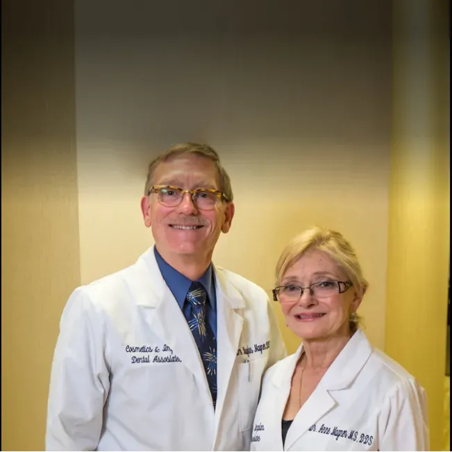 Cosmetic & Implant Dental Associates is a distinguished dental practice known for its exceptional care in cosmetic and implant dentistry. Guided by the seasoned expertise of Dr. Doug and Dr. Anne Magner, this dental duo has a remarkable knack for transforming smiles through meticulous procedures ranging from bone replacement surgeries to total teeth replacements. Patients rave about the quality of work, often highlighting the joy and satisfaction they feel with the end results.

The practice prides itself on leveraging the latest implant technologies, paired with a detailed, step-by-step explanation of procedures to ensure patients are fully informed and comfortable throughout their journey to a perfect smile. Those seeking routine dental maintenance also commend the practice for thorough cleanings that leave them feeling refreshed and confident.

Beyond clinical excellence, Drs. Doug and Anne, along with their dedicated staff, bring a personal touch to the experience, infusing warmth and humor into each visit. Their shared love for cats and light-hearted book recommendations, like "How To Tell If Your Cat Is Plotting to Kill You", further endears them to their clientele.

With over three decades of loyal service to their patients, Drs. Magner have demonstrated a relentless commitment to precision in dental work, ensuring even the smallest details, such as the exact color match of a crown, are not overlooked. Their eagerness to spend time discussing and explaining needed procedures fosters trust and a feeling of partnership with their patients.

The welcoming and professional team, labeled as 'THE BEST' by those they serve, encapsulates the compassionate ethos of the practice. Personalized attention considering patients' health, budget, needs, and availability underscores the care-centric approach that resonates throughout the patient experience.

In urgent situations, the practice has proven to be a haven for rapid and skilled response, as highlighted by patients in need of immediate attention. Visiting clients can expect an accommodating front desk and swift, effective solutions, such as the adept handling of emergency crown repairs that leave individuals amazed by the expedited and quality service provided by Dr. Douglas Magner.

At Cosmetic & Implant Dental Associates, every visit is an opportunity to improve not only dental health but also the overall sense of well-being, with each patient leaving with a smile enhanced by the hands of compassionate, talented, and attentive dental professionals. Description by ChatGPT.