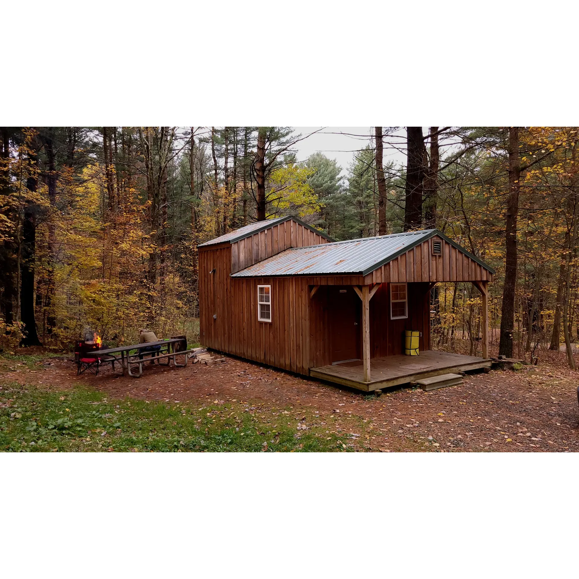 Red Bridge Campground is a serene oasis for outdoor enthusiasts and families seeking a tranquil retreat with abundant fishing opportunities. As a favored destination for a mid-spring fishing adventure, guests rave about the plentiful walleye and decent perch that can be caught even when bank fishing—a testament to the vibrant aquatic life inhabiting the local waters.

With an emphasis on immaculate upkeep, the campground takes pride in its disciplined management team. Visitors are quick to acknowledge and appreciate the meticulous attention to organization and dedication that ensures a pristine environment for all to enjoy.

For those who cherish privacy and comfort, the cozy cabins at Red Bridge Campground offer an agreeable retreat. The welcoming fire pit, grill, and picnic table situated at the backside of the cabins provide an idyllic setting for an intimate gathering or peaceful solitude amidst the beauty of the surroundings.

Praised for its seclusion, peace, and natural beauty, this smaller campground delivers an intimate experience without the distractions of the outside world. The serenity here is perfect for campers taking their first venture with a camper, with sites thoughtfully positioned to maximize privacy and proximity to the tranquil reservoir.

Red Bridge Campgrounds excels in site diversity, ensuring that whether you're in a tent or a cabin, you feel like you're truly in the woods rather than just another campground. The tent-only area boasts sites with decent spacing and separation, allowing for a genuine connection with nature. Cleanliness extends throughout the campground, from the well-maintained pit toilets to the up-to-date bathroom facilities—maintained with diligence even during unexpected moments, like when electricity is temporarily unavailable.

Enhancing the experience, the campground offers site-specific features that amplify the charm and comfort of the stay. For example, cozy accommodations come equipped with modern conveniences such as air conditioning, heat, microwave, toaster oven, and a mini-fridge. Moreover, the well-scattered sites ensure that every visitor has their fair share of space and privacy while on-site amenities like wood and ice contribute to a hassle-free camping adventure.

Red Bridge Campground is not just a stay but an experience—where campers return with fond memories of fishing, relaxation, and the simple joys of outdoor living, excited for their next visit. Whether it's the allure of the catch, the warmth of a fireside evening, or the privacy of the wooded enclave, it's a destination that leaves a lasting impression and beckons you back to its welcoming embrace. Description by ChatGPT.