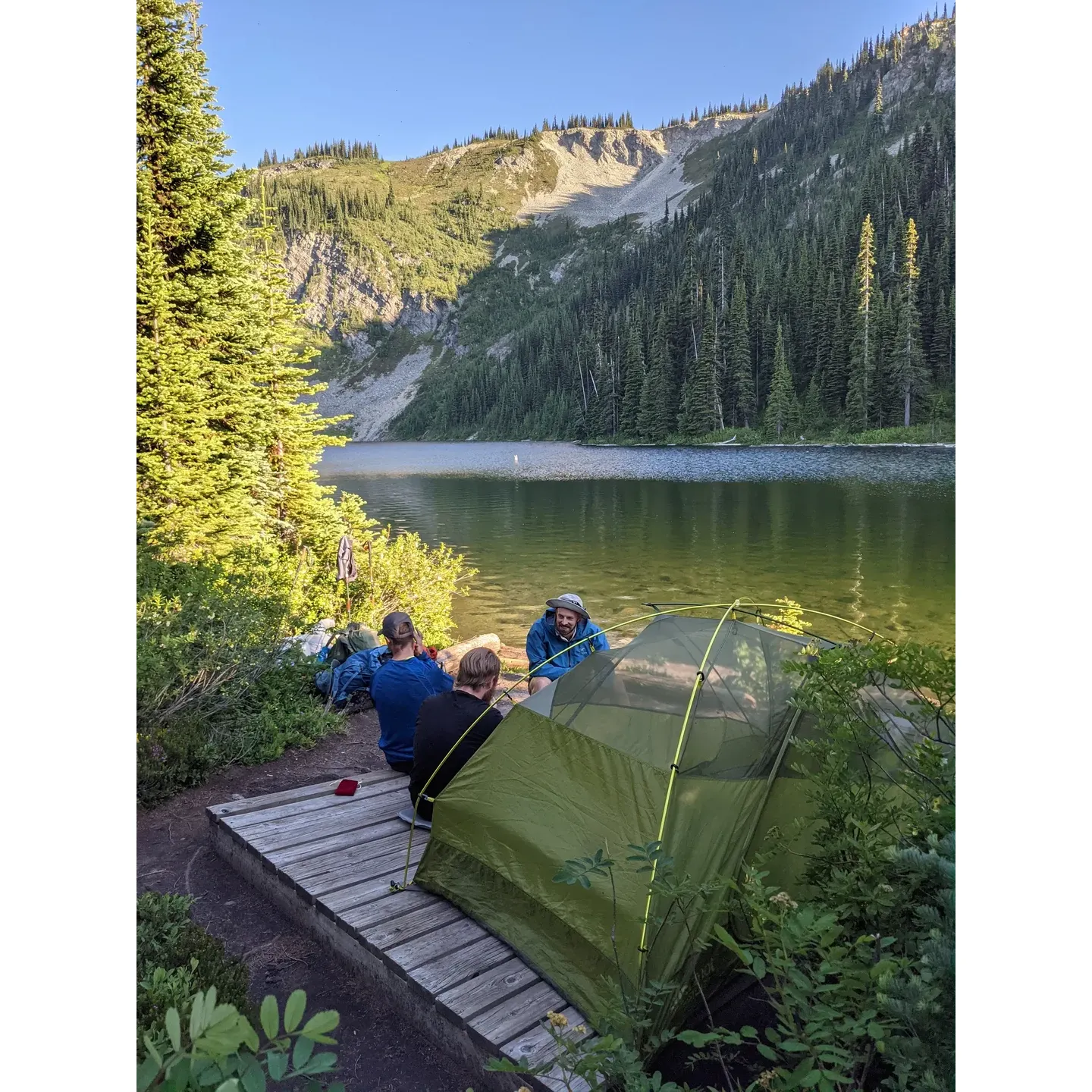 Discover an untouched oasis of tranquility at Nicomen Lake Wilderness Campsite within E.C. Manning Provincial Park, a true paradise for backpacking enthusiasts and nature lovers alike. Here, outdoor adventure meets comfort, with facilities strategically designed for the optimal camping experience. The grounds feature well-maintained toilet amenities for convenience, ensuring that your stay is as comfortable as it is exciting.

Safety is paramount in this wilderness retreat, emphasized by the provision of bear boxes to protect both wildlife and visitors. These secure storage containers allow campers to store their food and scented items, fostering a harmonious coexistence with the park's natural inhabitants.

For those seeking a serene escape, Nicomen Lake Wilderness Campsite offers a selection of tent pads that blend seamlessly into the landscape, including some that grant the most breathtaking views right on the lake's edge. Imagine waking up to the gentle lapping of water and the crisp mountain air each morning, setting the perfect tone for a day's exploration or relaxation.

The picturesque surroundings provide an idyllic backdrop for an array of outdoor activities. From hiking the scenic trails to fishing in the crystal-clear waters, there is something for every nature enthusiast. For those who simply wish to bask in the beauty of the wilderness, the ethereal beauty of this pristine location offers a profound sense of peace and rejuvenation that's hard to find elsewhere.

Tucked away within the splendor of E.C. Manning Provincial Park, Nicomen Lake Wilderness Campsite is more than a destination; it's an experience that echoes the essence of pristine wilderness camping. Whether you're a solo adventurer, a couple, or a group of explorers, this campsite promises unforgettable moments under the stars, surrounded by the majestic beauty of British Columbia's untamed landscapes. Description by ChatGPT.