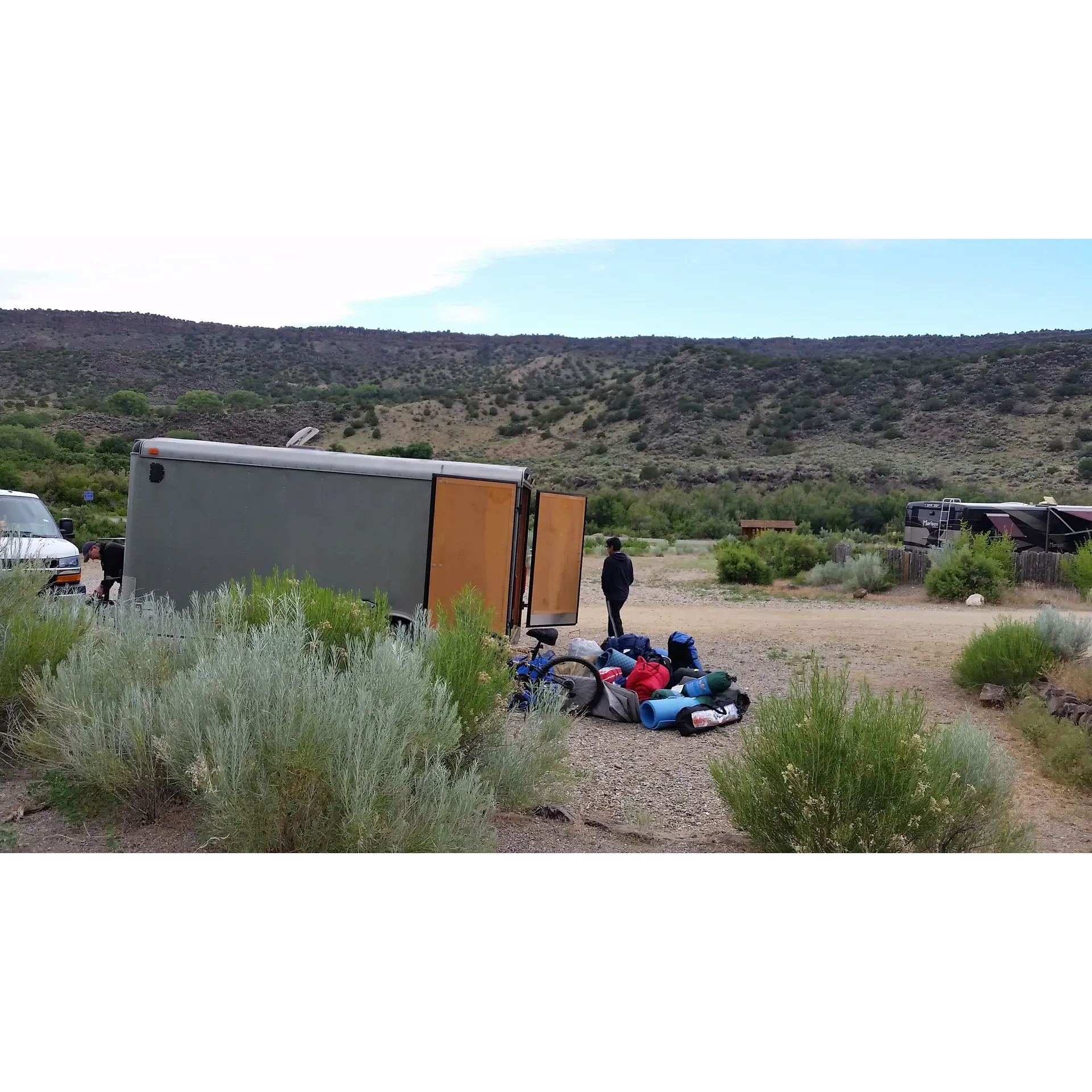 Pilar Campground offers adventurers a serene getaway along the banks of the Rio Grande River, providing an ideal spot for those seeking both nature's tranquility and outdoor activity. Set in a picturesque environment across the road from the river, this small developed Bureau of Land Management campground is an affordable and convenient base for travels between Taos and Santa Fe, as well as various rafting expeditions.

With its modest fee, the campground offers well-maintained RV sites equipped with water and electric hook-ups, including 20A/30A/50A service, making it a great deal at $15 per night. Tent campers will also find the $7 per night sites to be a steal. The grounds feature a few covered tables for comfortable dining amidst the scenic vistas, alongside clean restrooms with flushing toilets stocked with necessities such as toilet paper and soap – ensuring a comfortable stay.

Pilar Campground is not only budget-friendly but also imbued with the beauty of its surroundings. Visitors will enjoy the tranquil atmosphere and good views, especially from the well-kept areas that are perfect for setting up camp. With several hiking trails nearby, including one that starts right within the campground, guests have ample opportunity to explore the stunning landscapes. Additionally, the campground's close proximity to Taile offers easy access to food and entertainment options, albeit cellular service within the gorge may be limited.

The campground is one of seven within the Orilla Verde Recreation Area, each offering their unique charm and all benefiting from the enchanting Rio Grande gorge setting. While the sites are quite accommodating, larger rigs might find the access road a bit narrow, yet the payoff is found in the pretty canyon views and the peacefulness of the setting. Since the campground is quite popular due to its excellent facilities and location, early arrival is recommended to secure a good spot.

Pilar Campground is a gem for those seeking an outdoor experience that combines comfort with natural beauty, an inviting place for a memorable retreat at an exceptional value. Description by ChatGPT.