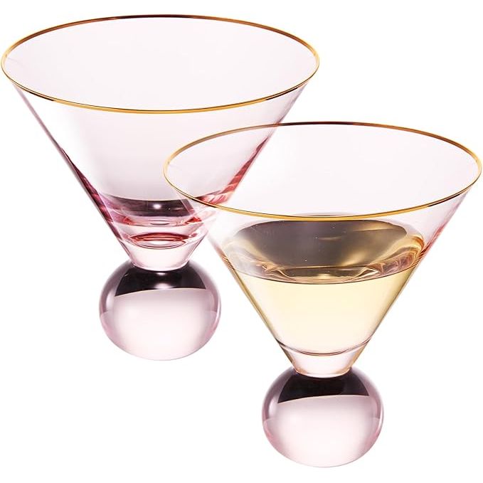 These stemless blush pink martini glasses come in a set of 2 and are perfect for serving cocktails at a bar or party. The unique bubble design at the bottom of the glass adds a modern touch to traditional cocktail glassware. The vintage muted pink color adds a touch of elegance to any gathering.
With a capacity of 10.