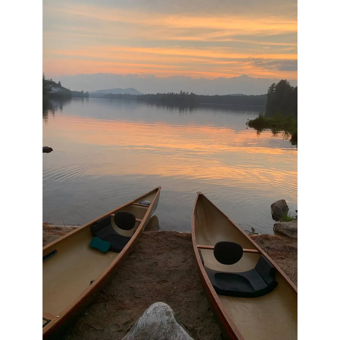 Forked Lake Campground is a true oasis for outdoor enthusiasts seeking a serene and beautiful camping experience. With its pristine, loon-filled lake and picturesque surroundings, it's a place where nature's tranquility takes center stage. Affordable state-run amenities such as canoe rentals at a mere $20 per day and reasonably priced firewood ensure guests can fully embrace the rustic charm of outdoor living without the hassle.

The campground boasts a variety of unique and appealing spots, including coveted island sites that offer an exclusive retreat. The island spot, holding two enchanting campgrounds, is particularly sought after, and those fortunate to book sites 11, 12, or 13 are in for an exceptional experience. Site 22 has also received special mention for its seclusion and the delightful sun exposure it offers from the late afternoon until sunset, perfect for sun seekers and nature lovers.

For those who wake up with the dawn, the sunrise over Forked Lake is not to be missed, casting a mesmerizing glow that sets the tone for a day of adventure or relaxation. The campgrounds are kept impeccably clean and maintained, ensuring every visitor's stay is comfortable and enjoyable.

Moreover, the availability of big bear lockers adds a layer of convenience for safe food storage. Although some sites may challenge your spirit of adventure, with access requiring a canoe ride or a journey through the forest, the reward of unparalleled privacy and stunning lake views is well worth the effort.

Prepare to partake in a delightful experience akin to the whimsical adventure of “Moonrise Kingdom,” and enjoy the thrill of canoeing to your very own secluded campsite. With the nearby marsh ripe for exploration and the tranquil lake perfect for canoeing, Forked Lake Campground provides a full spectrum of outdoor pleasures. And while the natural cycle may bring mayflies, the camp manager's on-site presence and helpful demeanor ensure that any minor inconveniences are swiftly addressed.

In essence, Forked Lake Campground is not just a place to stay - it's a scenic haven for those who crave a peaceful getaway amidst the wonders of the wilderness. Whether you're basking in the quietude of a private island campsite or paddling through still waters, your connection with nature here is bound to be unforgettable. Description by ChatGPT.