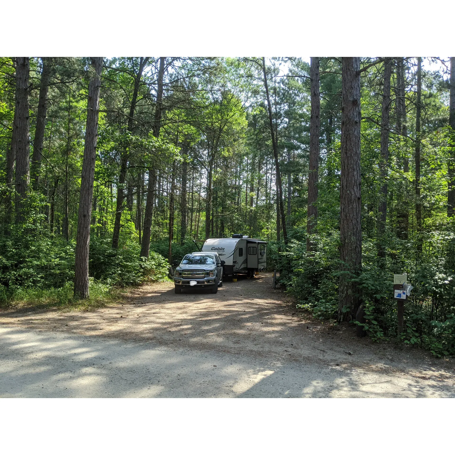 Chippatawa National Forest Onegume Campground offers a serene retreat for outdoor enthusiasts and families alike. The campground provides an array of sunny and shaded sites, suitable for both tents and trailers, with certain spots boasting ample room for hammocks, inviting campers to relax amidst the forest's natural tranquility. Guests frequently remark on the campground's quietude and the delightful presence of local wildlife, including a symphony of birds and the playful antics of chipmunks, enhancing the atmosphere of peacefulness.

With picturesque views of the lake from select spots, the campground allows visitors to enjoy the beauty of waterside living without needing to be directly on the lakeshore. Outdoor activities are readily accessible with hiking trails to explore and reports of decent fishing opportunities for those looking to cast a line into the surrounding waters. 

Campground hosts are noted for their hospitality, adding a welcoming touch to the camping experience. While the campground maintains a rustic charm, guests can still enjoy the conveniences of electric hookups, ensuring a comfortable stay. Families in particular find Onegume Campground to be an accommodating destination, where the natural surroundings offer a backdrop for creating cherished memories.

Amidst the beauty of towering white and red pine trees, some sites offer an exceptional experience akin to a private lake cabin getaway. While the campground celebrates its simpler, more rustic appeal, it remains a beautiful setting for a quiet, family-friendly escape in the great outdoors. Description by ChatGPT.