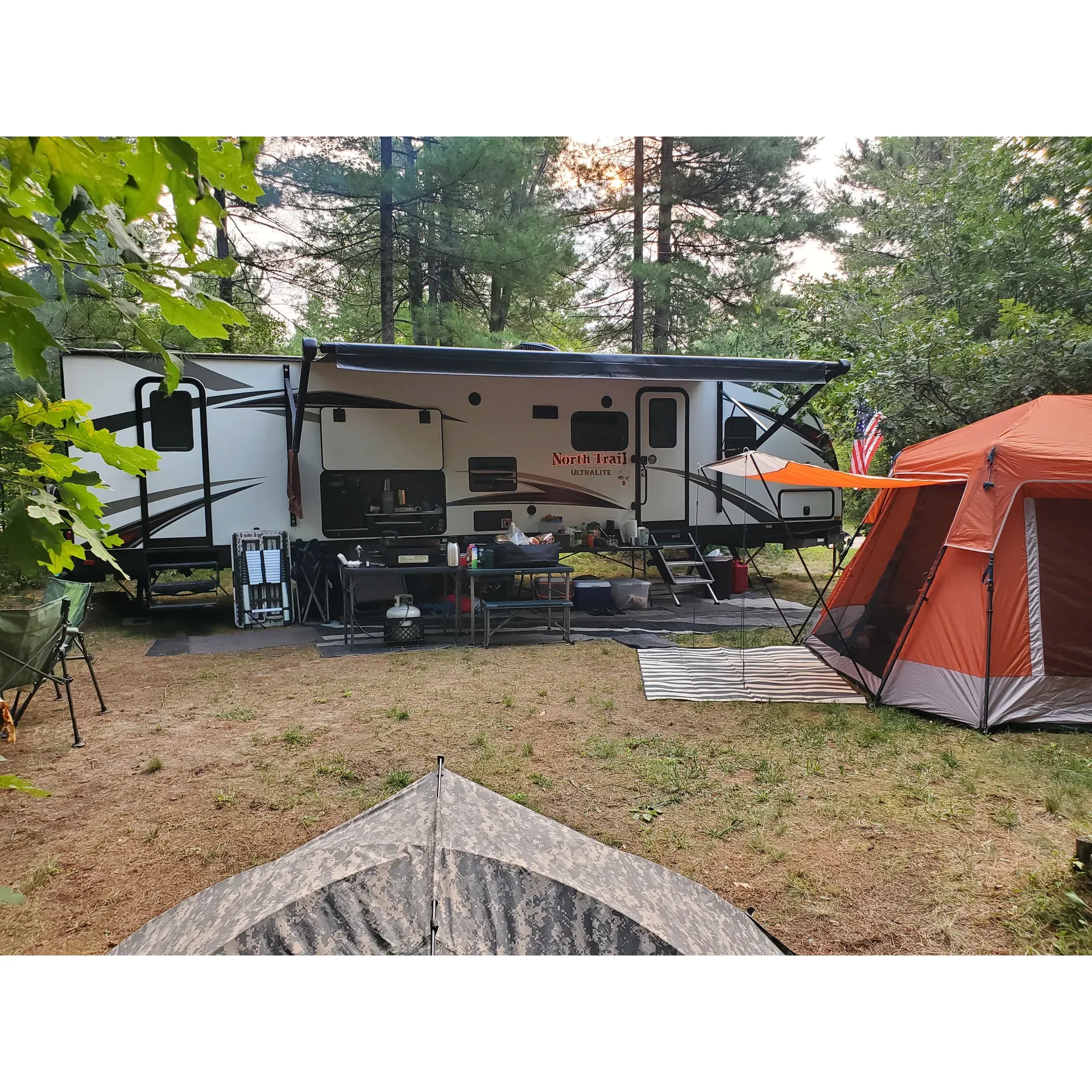 Jones Lake State Forest Campground is an idyllic retreat for nature lovers offering a tranquil camping experience amidst towering trees and scenic surroundings. Visitors flock to the campground for its picturesque setting by a beautiful and clean lake, known for its clarity and inviting waters.

The campground is favored by those seeking a rustic outdoor adventure with the allure of privacy and ample space. Campsites are well-dispersed, providing a sense of solitude even during peak seasons. For those visiting in the quieter months, the sense of serenity is further amplified with many inland loops remaining unoccupied, allowing for a more intimate connection with nature.

An added draw is the family-friendly beach and the convenience of having a boat launch immediately adjacent to the campground, providing easy access for water enthusiasts keen on swimming or exploring the lake by boat. The well-maintained trails from the campsites to the lake cater to both casual strolls and avid hikers looking to immerse themselves in the natural beauty of the surroundings.

For the anglers, the catch and release fishing lake promises a peaceful and respectful fishing experience without the bustle often found in popular fishing spots. As the sun sets, the campground becomes a vantage point for breathtaking vistas with amazing sunsets painting the sky in vivid hues, an experience that many guests cherish.

Visitors frequently commend the campground for its clean and well-maintained beach, making it an ideal spot for families to relax and enjoy. The quietness of the night is often noted, allowing campers to settle into a restful sleep lulled by the gentle sounds of the forest.

During the off-peak season, particularly after Labor Day, campers can take pleasure in the added tranquility and the vibrant display of fall colors that adorn the forest canopy. The select campsites present an exceptional harmony of solitude and natural charm, as the lower occupancy brings an even greater level of peace.

The campground's proximity to the neighboring city of Grayling is convenient for those who might wish to venture out for supplies or a little bit of urban flair before returning to the seclusion of the wilderness retreat. Despite its rustic nature, the campground ensures that essentials like clean outhouses are well taken care of, ensuring a comfortable stay for all guests.

Jones Lake State Forest Campground has also been recognized as a 'hidden gem' for its clear water and compact sandy beaches, ideal for swimming and sunbathing. Visitors seeking an authentic camping experience with a strong emphasis on nature, tranquility, and unspoiled landscapes will find this campground to be the perfect escape from the bustle of everyday life. Highly recommended for its privacy, beauty, and peaceful environment, it's a destination that calls to those yearning for a genuine connection with the great outdoors. Description by ChatGPT.