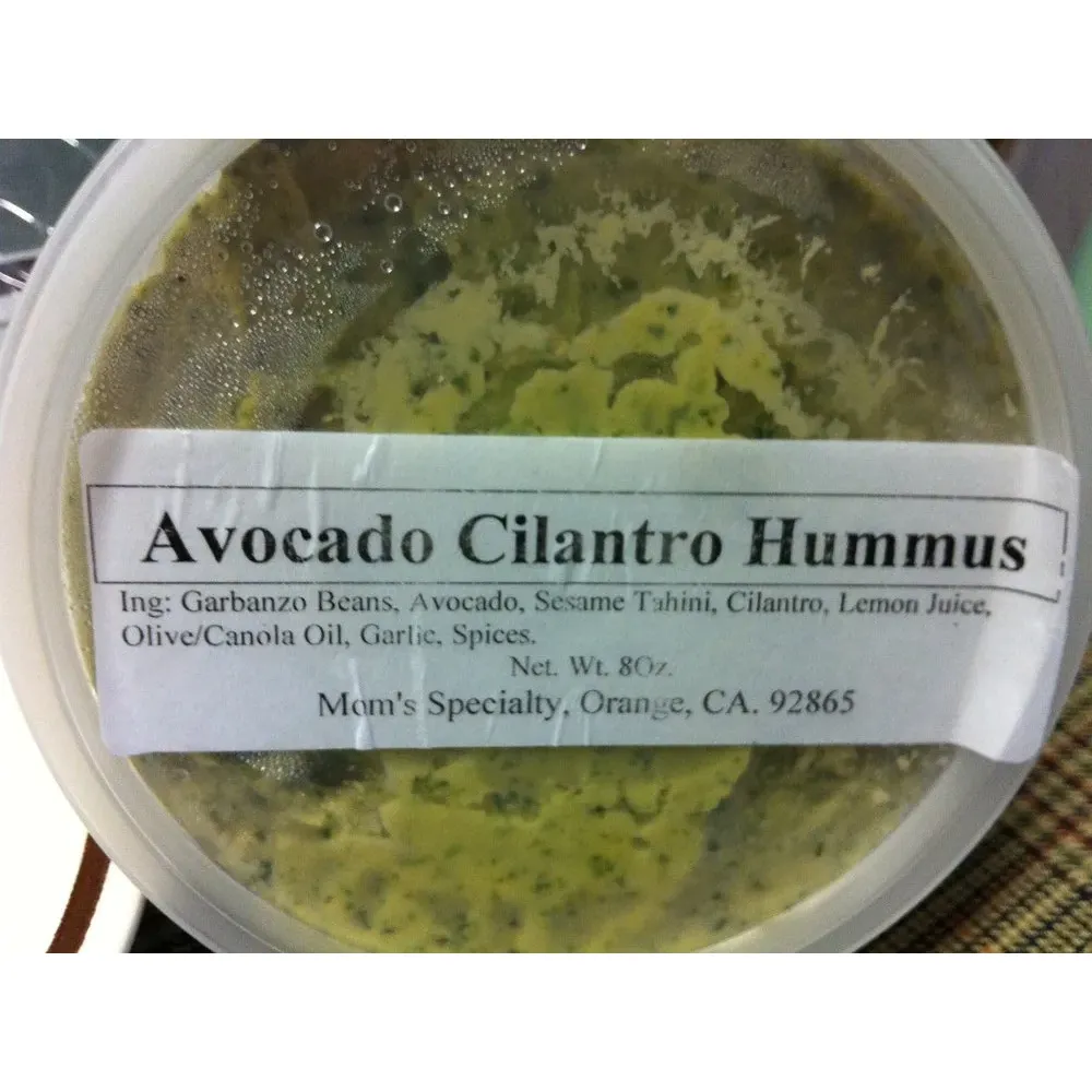 Mom's Specialty Food is a beloved inclusion at Newport Beach's vibrant farmers market scene, well-loved for their exceptional hummus and homemade pita chips that have captivated the tastebuds of both locals and visitors alike. Unmistakable for their fresh, gourmet offerings, customers rave about the unique and bold flavors like cilantro jalapeño, as well as traditional favorites whose names alone evoke intrigue and appetite.

Famed not only for their creamy, original hummus and zestfully seasoned lemon pita chips, Mom's Specialty Food has established itself as a benchmark for quality, often described as superior to commercially available brands. Devotees of their products find it almost impossible to resist the urge to indulge in these homemade delights, with some expressing an ardent desire for the brand to expand its reach beyond the sunny shores of California.

While they have yet to set up a permanent store, the pleasure of enjoying Mom's Specialty Food's creations isn't only for those strolling the farmers market aisles; they've made their mark by serving up satisfaction to workplaces as well, ensuring that a mid-week treat is never far away. Using simple, wholesome ingredients, they craft not only the best hummus and pita bread but also offer a scrumptious tomato cucumber salad mix that completes the meal experience.

Those who have tasted Mom's Specialty Food's artisanal products will attest to the lasting impression they leave, having transformed many into hummus enthusiasts. Their dedication to flavor and quality makes them a cherished destination for anyone in search of the perfect blend of taste, freshness, and friendly service. Truly, Mom's Specialty Food represents a culinary highlight for anyone seeking to savor the flavors that capture the essence of homemade authenticity. Description by ChatGPT.