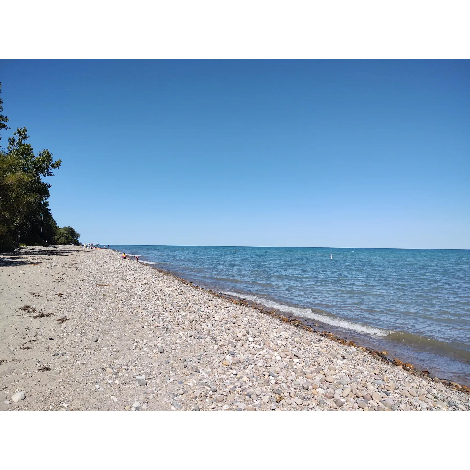 Lakeport State Park offers a serene oasis for leisure and outdoor enthusiasts on the shores of Lake Huron. Renowned for its distinctive rocky beach, the park is a haven for rockhounding aficionados, inviting visitors to explore and discover the unique stones and geological treasures. While the shoreline is adorned with rocks, careful beachgoers can still find sandy patches to relax and soak up the sun, contributing to the park's varied and pristine landscape.

Visitors to Lakeport State Park can experience the tranquility of a clean, well-maintained environment. The park's campgrounds are well-regarded for their spaciousness, with sizable asphalt-padded sites that accommodate both tents and RVs. The dedicated staff on-site is known for their warmth and attentiveness, ensuring a friendly and welcoming atmosphere for all guests.

Lakeport State Park's appeal extends beyond its beautiful beach. With delightful hiking trails meandering through the woods, the park offers a chance to immerse oneself in nature and engage in a healthy, active lifestyle. The shallow waters along the beach provide a refreshing retreat during the summertime, perfect for a gentle swim or a leisurely paddle.

For those seeking a more community-oriented experience, the park is celebrated for its special events, such as the enchanting Halloween festivities where children can trick or treat safely within the campground. Additionally, the camp store offers delectable treats like ice cream, adding a sweet note to the park's offerings.

Lakeport State Park also serves as an ideal stopover for travelers heading to Canada, making it a convenient respite on long journeys. The spacious camping spots, paired with the invaluable presence of amicable camp hosts, ensure a comfortable and seamless stay.

Visitors can start their days by witnessing breathtaking sunrises over Lake Huron, a spectacle that promises to enchant and inspire. The park's reputation for maintaining a welcoming and well-appointed outdoor space assures guests a memorable visit, whether for a day trip or an extended camping adventure. Description by ChatGPT.