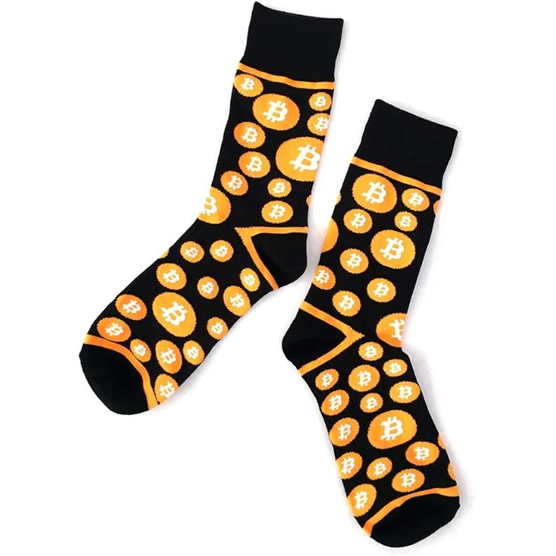 Bitcoin Dress Socks features a unique and stylish design that incorporates the iconic Bitcoin symbol, making them a perfect accessory for cryptocurrency enthusiasts and tech-savvy individuals. The socks come in a pack of two pairs, allowing for versatility in styling options.