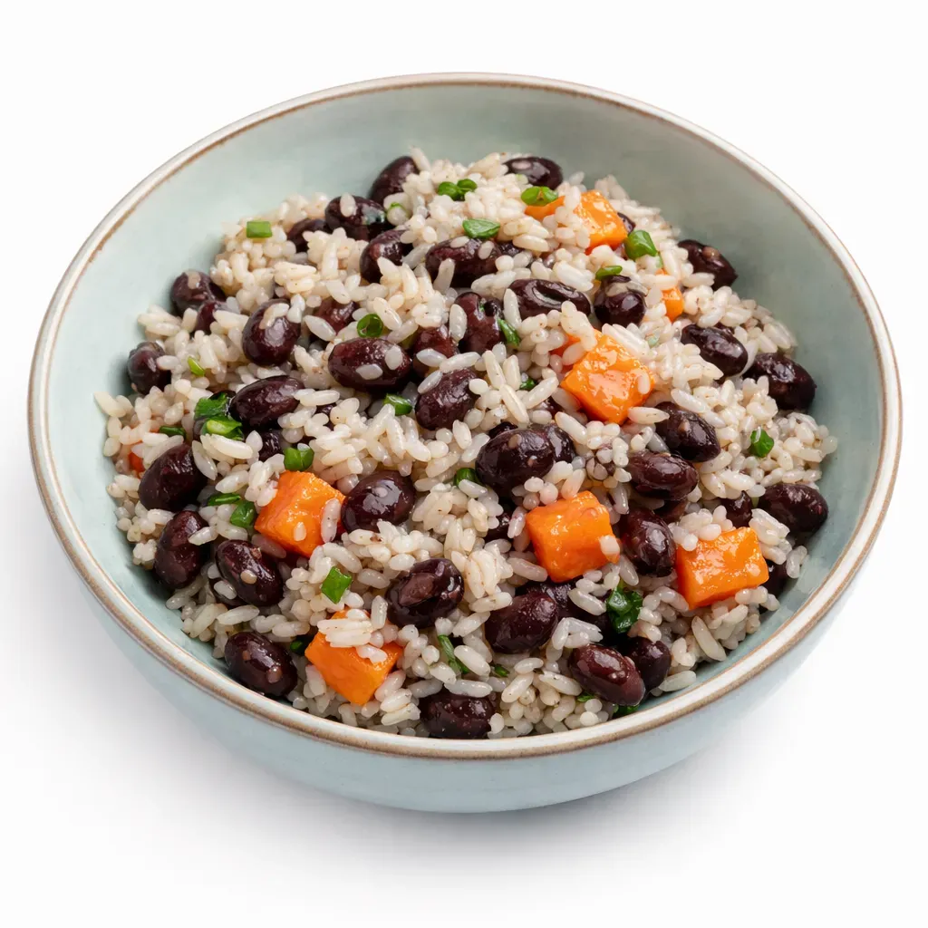 A delightful Costa Rican breakfast featuring Gallo Pinto, a savory rice and black bean dish, alongside Chorreadas, sweet corn pancakes, perfect for a traditional breakfast experience.