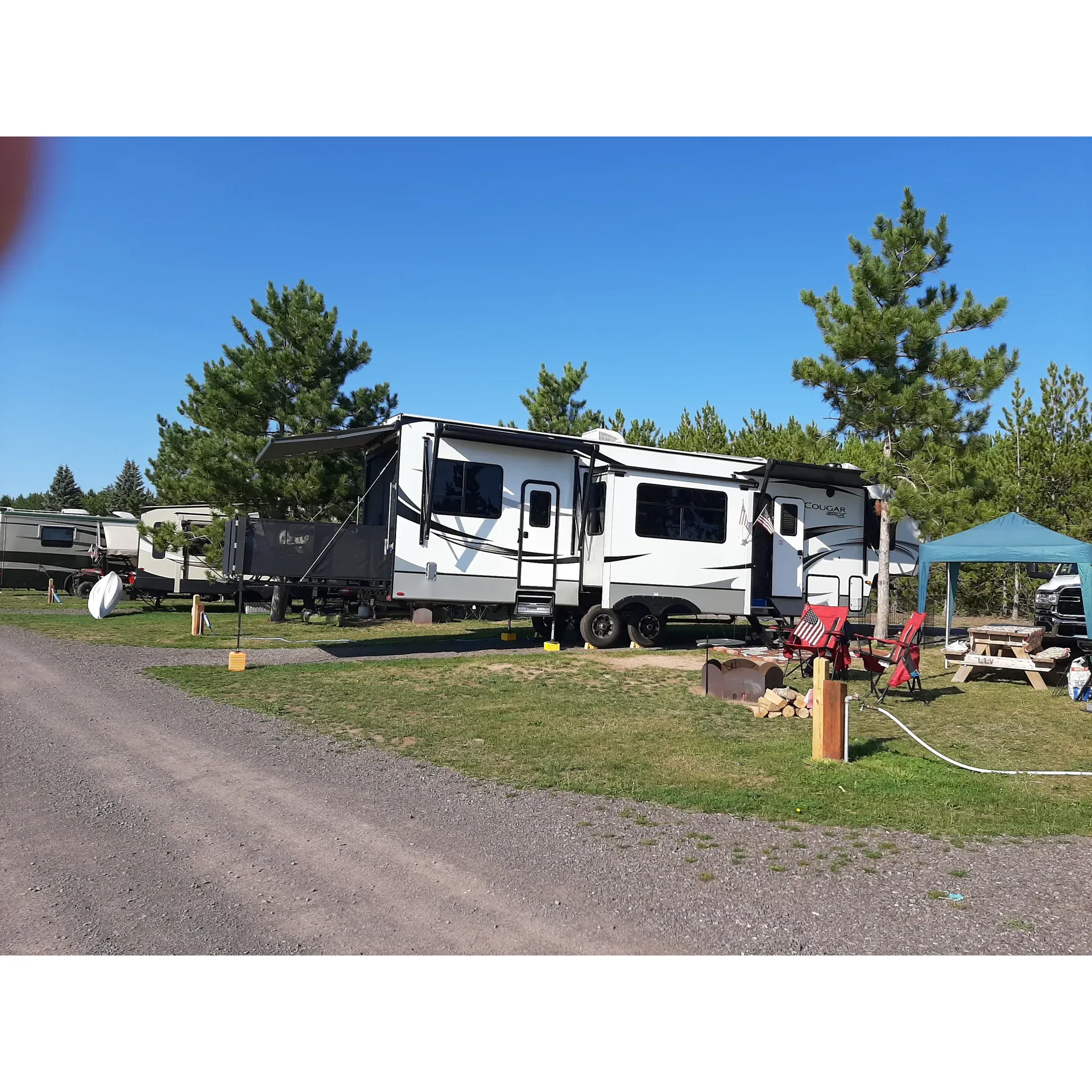 Lake Linden Campground is a serene retreat that offers a picturesque setting for a remarkable camping experience in the Upper Peninsula, adjacent to a beautiful lake with an expansive beach and playground area perfect for families. It provides an array of full hookup sites at remarkably affordable rates, ensuring guests can enjoy the great outdoors with the comforts of home.

Visitors can appreciate the modern conveniences of Wi-Fi connectivity throughout the campground, allowing for both relaxation and the ability to stay connected when needed. The campground prides itself on its well-maintained amenities, including cleanly bathrooms and facilities that add to a comfortable stay.

The camp is praised for its exceptional park host, who contributes to the pleasant and welcoming atmosphere, ensuring that the guests' needs are met. Despite being a hub of activity, the campground offers pockets of tranquility and is noted for its friendly and community-oriented feel. Regular maintenance of the facilities, including shower houses with secure access, is a testament to the campground's commitment to guest comfort.

Additionally, the campground's proximity to the nearby charming town allows guests to engage in local dining and social activities, enriching their camping experience with a taste of local life. Each campsite comes equipped with a fire ring, electricity, water, and a picnic table, allowing campers to settle in and enjoy their stay with all the necessary amenities.

Overall, Lake Linden Campground is recognized as a highly desirable location that is both picturesque and well-appointed, offering an ideal base for exploring the northern tip of the Upper Peninsula, with a friendly community vibe that keeps guests coming back for the natural beauty and fantastic hospitality. Description by ChatGPT.