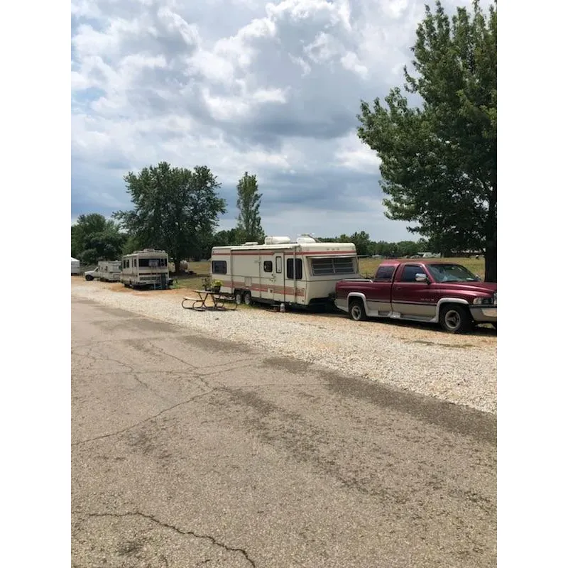 Coneflower Campground offers an outdoor enthusiast's paradise, ideal for those who appreciate the seasonal charm and natural beauty of the great outdoors. The campground boasts incredible fallscapes that have the power to turn even the most casual camper into a passionate devotee of autumnal camping. With its vast array of gorgeous views and an ambiance that invites the local wildlife to share in the experience, guests find themselves immersed in nature's serenity.

Providing 24-hour access and an efficient self-registration system, Coneflower Campground caters to travelers' schedules, facilitating smooth transitions for those on the move or seeking a spontaneous adventure. Conveniently positioned close to town, it serves as a perfect hub for guests to enjoy local dining, shopping, and attractions, such as checking out the nearby university.

For those with recreational vehicles, the campground offers essential amenities, including a well-organized dump station and sites with electrical hookups, accommodating needs for a comfortable stay. The park is also celebrated for its quiet, tranquil atmosphere, reflecting a bygone era of simplicity reminiscent of countryside living.

Coneflower Campground is designed to suit any camping style, from tenting under the stars to occupying a spacious RV pull-through site. The opportunities for outdoor activities are abundant, with boating, biking, and hiking readily available to create an engaging, active experience or a restful retreat at the guest's discretion.

In essence, Coneflower Campground is a gateway to creating lasting outdoor memories, providing a versatile and picturesque setting for campers seeking to reconnect with nature and enjoy the splendor of an undisturbed natural environment. Description by ChatGPT.