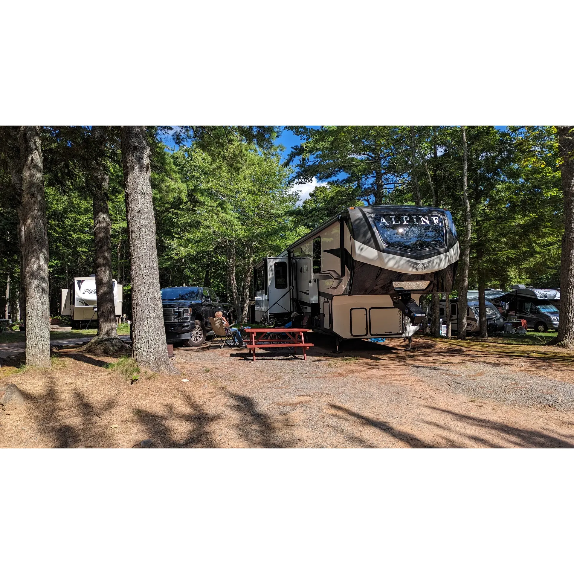 Highbury Gardens RV Park is a serene getaway spot for travelers seeking a harmonious blend of the tranquility of nature and the convenience of modern amenities. Situated in close proximity to the charming town of Wolfville, the RV Park offers an idyllic base for visitors to explore the surrounding areas. Its prime location ensures guests are just a stone's throw away from local attractions, while still providing a peaceful retreat.

The park's layout is a testament to meticulous maintenance, with a range of well-appointed sites that are complemented by the lushness of mature trees, ensuring a comfortable and spacious environment without feeling overcrowded. The dedication to upkeep is evident in the pristine condition of not only the grounds but also the facilities.

Guests have praised the cleanliness and freshness of the bathrooms and the convenience of complimentary showers that encourage water conservation. For those seeking relaxation, a sparkling pool provides the perfect spot to unwind, while a playground offers younger guests their own slice Memorial Golf Course" of fun.

Community spirit is at the heart of Highbury Gardens RV Park, where the warmth and friendliness of fellow campers and helpful staff create a welcoming atmosphere. The staff, particularly noted for their helpful guidance and willingness to accommodate, make every stay comfortable and worry-free. Generosity shines through the campsite's culture, where food sharing among guests is facilitated by the staff, ensuring that kindness and camarity are always part of the experience.

Ideal for both the self-contained traveler and those searching for a touch of home comfort, this family-run park has secured its reputation as a top-tier destination for both short stays and seasonal visitors. With its well-deserved accolades for maintaining an environment that is both quiet and convivial, Highbury Gardens RV Park is the perfect destination for those seeking a truly delightful camping experience in the valley. Description by ChatGPT.