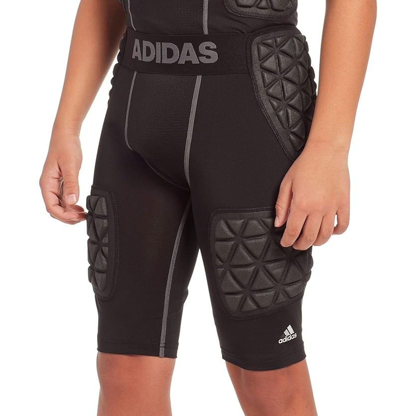 The adidas Youth Techfit 5 Pad Integrated Football Girdle is designed to provide young football players with durable protection and comfort during games. The girdle features five integrated pads strategically placed on the hips, tailbone, and thighs to absorb impact and reduce the risk of injury.