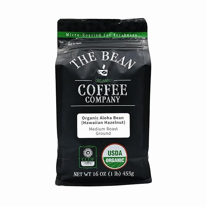 The Bean Organic Coffee Company's Aloha Bean (Hawaiian Hazelnut) is a medium roast, ground coffee available in a 16-ounce bag. This coffee is made with organic and fair trade beans, ensuring that the coffee is sustainably sourced and produced. The Hawaiian Hazelnut flavor adds a unique and delicious twist to this medium roast coffee.