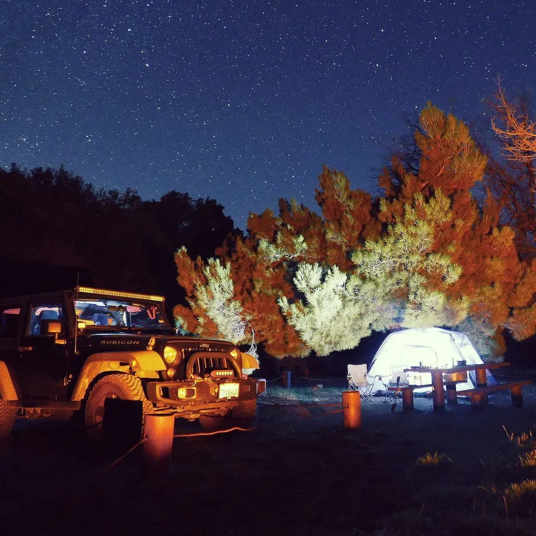 Immerse yourself in the simplicity and tranquility of the great outdoors at Toad Springs Campground, a pure and unspoiled retreat for those eager to escape the hustle and bustle of the modern world. This charming campground offers a refreshing back-to-nature experience, ideal for those who appreciate minimalistic adventure and are prepared for a self-sufficient stay.

With five distinct camping spots available, visitors can find their own slice of wilderness to set up their tent or park a small trailer, creating a personal haven amidst the open skies and natural surroundings. Each campsite comes equipped with a sturdy picnic table and a well-maintained metal fire pit, ensuring that guests can dine al fresco and share stories around a crackling fire under the stars. Guests are reminded to carry an ample water supply to ensure safe and enjoyable fire practices.

Immerse in the quietude as Toad Springs offers a peaceful haven, often providing solitude as it is a hidden gem that many have yet to discover. This is the perfect setting for reflective solo journeys, serene getaways, or intimate group excursions. The uncrowded space allows for a sense of privacy and connection with nature not often found in busier locales.

For the exploratory spirit, the surrounding environment teems with opportunities for hiking, where well-established trails beckon to be discovered. Birdwatchers will find themselves delighted by the variety of feathered friends that can be spotted among the trees, adding a harmonious soundtrack of bird calls to the peaceful atmosphere.

Enthusiasts of two-wheeled adventures will occasionally enjoy the sight of dirt bike riders zipping by, providing a distant echo of civilization amidst the otherwise untouched landscape. Despite the rugged approach road, adventurous travelers prove that even in less than ideal vehicles, the journey is part of the experience and well worth the effort.

For the nature-loving visitor, Toad Springs Campground is a precious retreat, promising a serene getaway filled with simple pleasures and the unrivaled beauty of the natural world. It's genuinely a place where you can reconnect with the environment and enjoy the very essence of what camping should be. Description by ChatGPT.