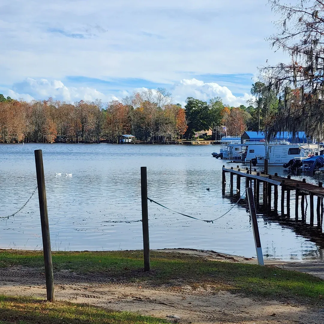 Polly's Landing is a picturesque lakeside destination that invites visitors into a serene atmosphere aglow with enchanting scents, sights, and sounds. An oasis for relaxation and recreation, it boasts an array of delectable dining options, warm and engaging locals, and recreational activities that cater to all ages. With boat rentals available, it's the perfect spot to embark on a leisurely aquatic adventure or simply enjoy the beauty of the surrounding parks.

Guests are greeted by a team of friendly and accommodating staff dedicated to ensuring that every visit is seamless, from the ease of boat launching to providing essential amenities. The landing serves as an ideal starting point for exploring the tranquil waters of Lake Marion, and with excellent prices on essentials like ice, it ensures that your outdoor experience is both enjoyable and affordable.

Polly's Landing is also a charming venue for festive gatherings or tranquil retreats away from the hustle of daily life. A favorite for both locals and visitors, it maintains a cozy, family-friendly atmosphere year-round. With ample parking available and an affordable fee for its well-maintained boat launch facilities, Polly's Landing is the go-to spot for those seeking a day filled with joy, a night under the stars, or a memorable lakeside event. Description by ChatGPT.