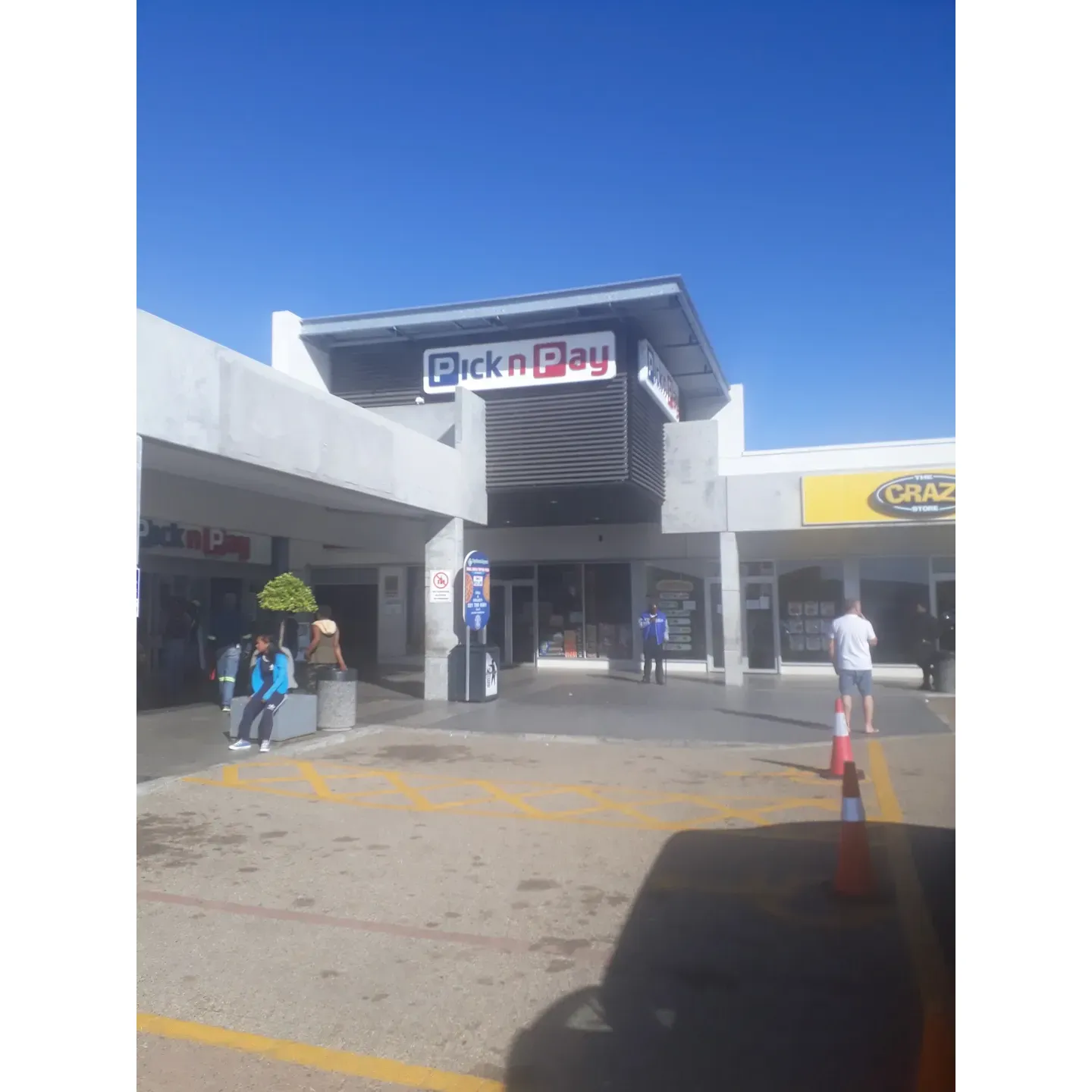 Pick n Pay QualiSave Muizenberg provides a convenient one-stop shopping experience, offering an array of products to cater to the needs of the local community. It prides itself on extending a diverse selection of merchandise, allowing shoppers to find almost everything they require under one roof. This branch, although more compact than some of its counterparts, maintains a focus on organization and presentation, ensuring a neat and tidy shopping environment. 

Customers seeking quick and easy purchase options can take advantage of the store’s assortment of snacks, perfect for those on the go or looking for a bite to avoid the chill of a cold day. The staff, recognized for their approachable demeanor, add to the overall welcoming atmosphere of the store. 

Conscious of the busy lives of its customers, the store endeavours to streamline the checkout experience, especially during the bustling lunch hours. Pick n Pay QualiSave in Muizenberg is aware of the importance of time management and strives to offer efficient service to make every visit as quick and pleasant as possible. Description by ChatGPT.