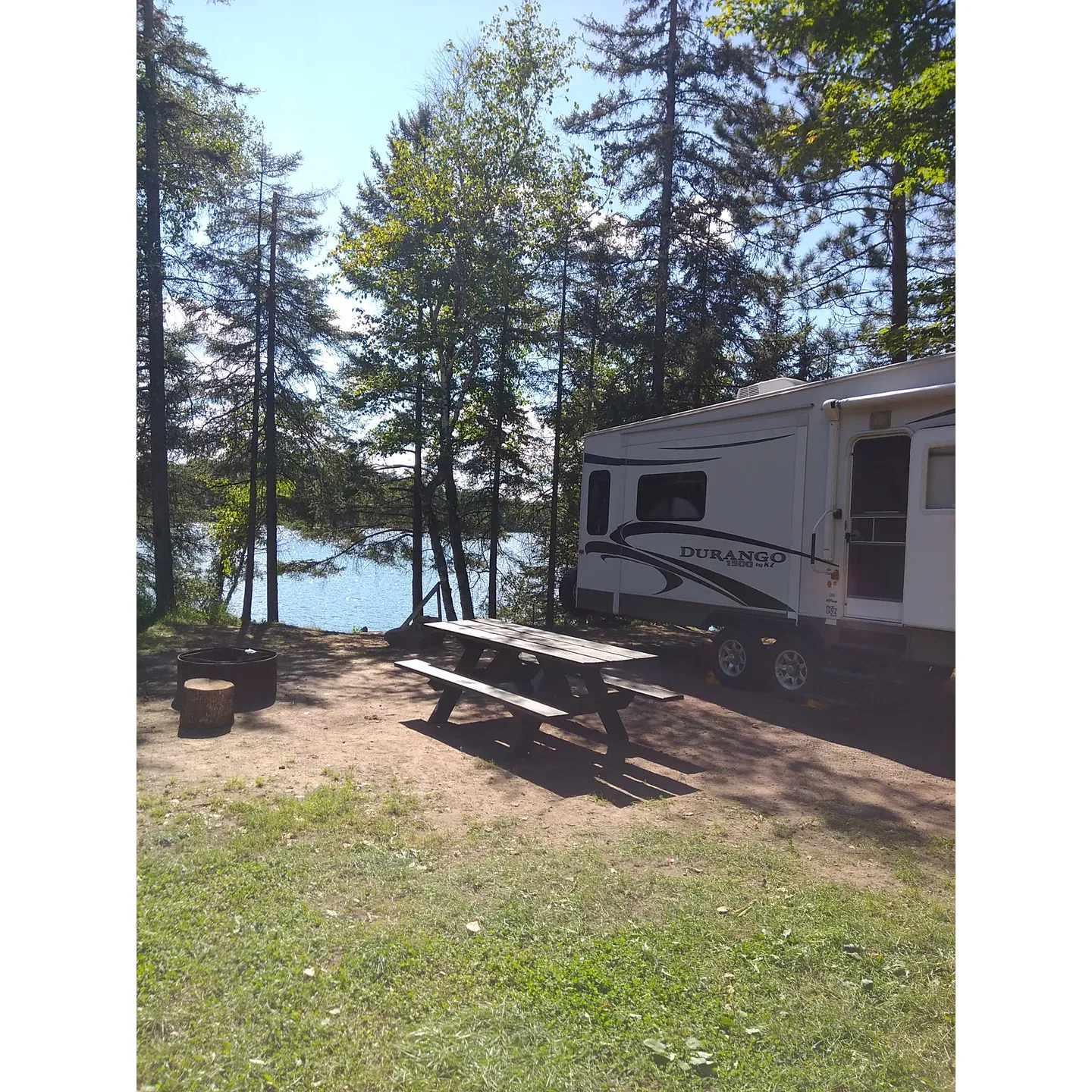 Bass Lake State Forest Campground offers a retreat into the great outdoors for camping aficionados, whether they come with a modest tent or a sizable 42-foot fifth wheel. The campground is praised for its well-maintained roads and ample spaces, providing plenty of room for larger RVs. Visitors seeking tranquility and a break from the everyday hustle will appreciate the scenic locale that this campground provides, complete with beautiful, large, rustic sites.

The forest setting creates a serene backdrop for the 22 available sites, delivering an intimate experience due to the campground's layout and capacity. The secluded nature of the campground ensures a peaceful stay, especially when it is not fully occupied, allowing for a heightened sense of privacy. For those in search of simplicity and self-sufficiency, the facility offers self-registration, adding to the charm of a more traditional camping experience.

For recreational activities, guests can enjoy the convenience of a boat ramp, making water excursions on the lake effortless. The allure of swimming right from your campsite is an added luxury for water enthusiasts. Though the natural surroundings offer an unspoiled environment, guests also enjoy amenities such as vault toilets, providing a comfortable stay in the midst of nature's embrace.

With its secluded setting and its accommodations for a variety of camping styles, Bass Lake State Forest Campground is a gem for those looking to immerse themselves in the tranquility of the forest and the joy of lakeside leisure. Description by ChatGPT.