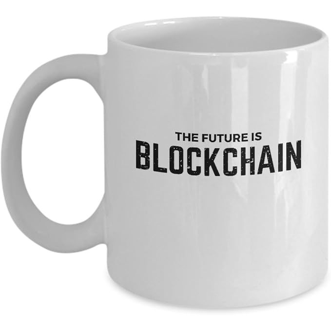 The Future Is Blockchain Coffee Mug is a white ceramic mug featuring a custom printed design inspired by digital currency and blockchain technology. This unique mug is a great gift idea for anyone interested in technology, cryptocurrencies, or the future of finance.