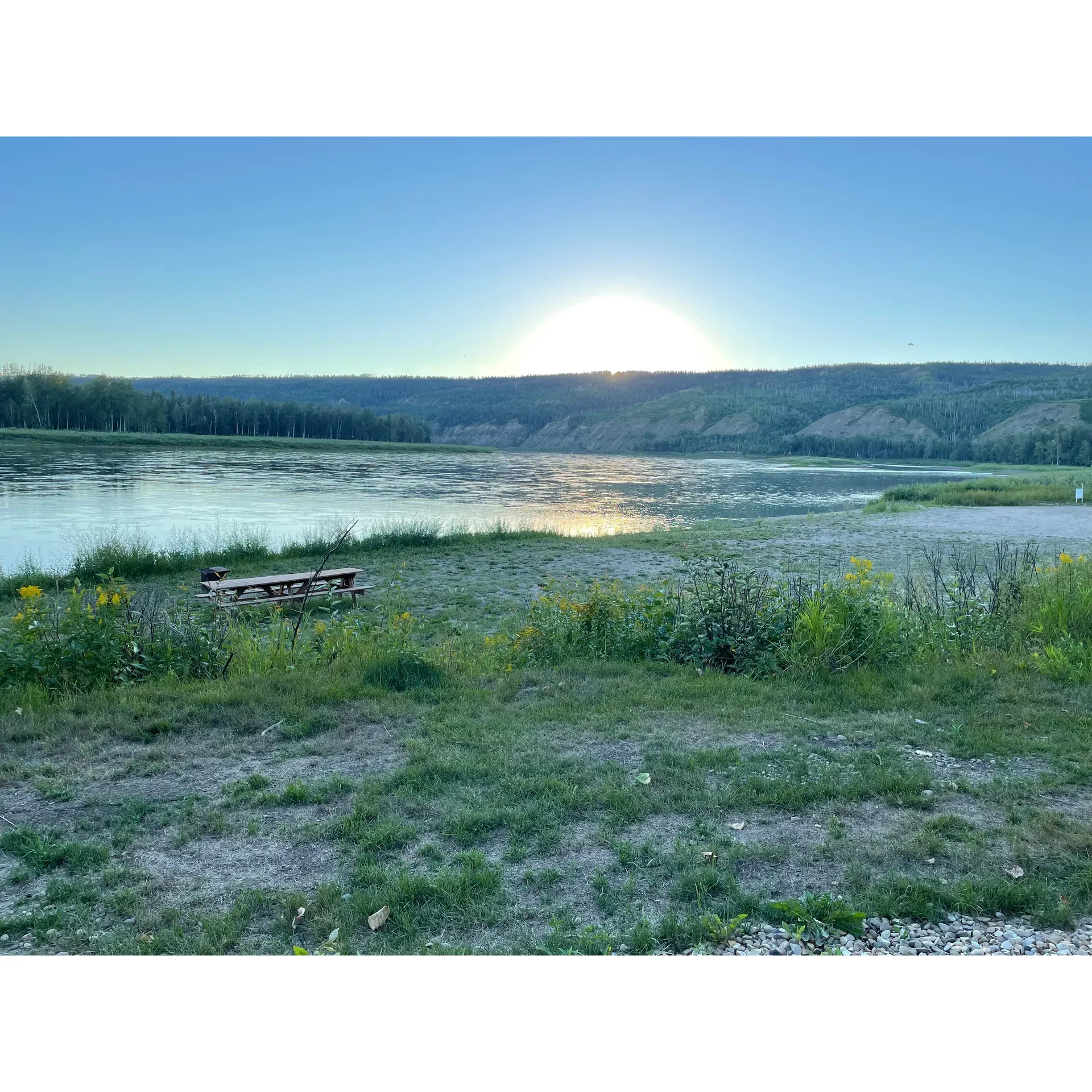 Located along the idyllic banks of the Peace River, Many Islands Campground offers visitors a tranquil escape into the great outdoors. Boasting scenic landscapes accentuated by the majesty of old-growth Poplar trees, the campground presents a beautiful place that harmonizes with nature.

Guests can enjoy the serenity of the well-maintained grounds, savoring the added bonus of complimentary firewood, which adds to the coveted outdoor experience. The area is a visual delight, offering stunning views that unfold along the river, providing a picturesque backdrop for every camping adventure.

Families will also appreciate the inclusion of playgrounds—a hit for kids looking to play and explore in a safe and fun environment. While the fishing may be challenging, the campground’s location is perfect for those who enjoy boating, with the river inviting guests to set sail and navigate its serene waters.

Many Islands Campground captures the essence of accessible wilderness camping at an excellent value, presenting an opportunity for guests to create cherished memories in a peaceful, friendly, and beautiful environment. Description by ChatGPT.