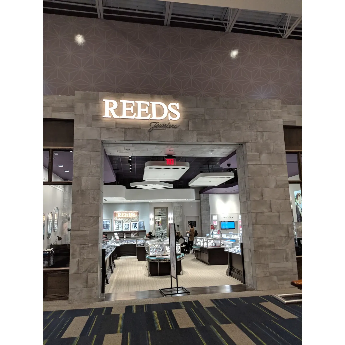 REEDS Jewelers at Concord Mills stands out as a premier destination for discerning shoppers seeking an exceptional jewelry buying experience. The store has earned a sterling reputation for its impeccable customer service, as exemplified by the caring and attentive team. Staff members such as Ashton, Claudia, and the commendable Ms. Jaya consistently go above and beyond to deliver a service that is both kind and welcoming, cultivating a familial atmosphere that customers deeply appreciate.

Dedicated to helping each visitor find the perfect piece, REEDS Jewelers distinguishes itself through the helpful, patient guidance offered by its knowledgeable team. Whether assisting customers in selecting elegant wedding bands or crafting the ring of their dreams, the staff demonstrates a remarkable combination of efficiency, courtesy, and in-depth product insight.

REEDS Jewelers also prides itself on its flexible and customer-oriented policies, including the hassle-free price matching process that has been praised as one of the easiest and most accommodating experiences by returning customers. The store's commitment to an outstanding shopping experience has fostered a loyal customer base that exclusively returns to this location for all their jewelry needs.

Moreover, the no-pressure environment allows customers to explore a vast selection of products, ensuring that each purchase is made with complete satisfaction and joy. REEDS Jewelers' unwavering dedication to customer delight, along with the sincere treatment received from its staff, has successfully established the store as a five-star worthy establishment and a magnet for those who seek quality, value, and a touch of emotional connection with their jewelry purchases. Description by ChatGPT.