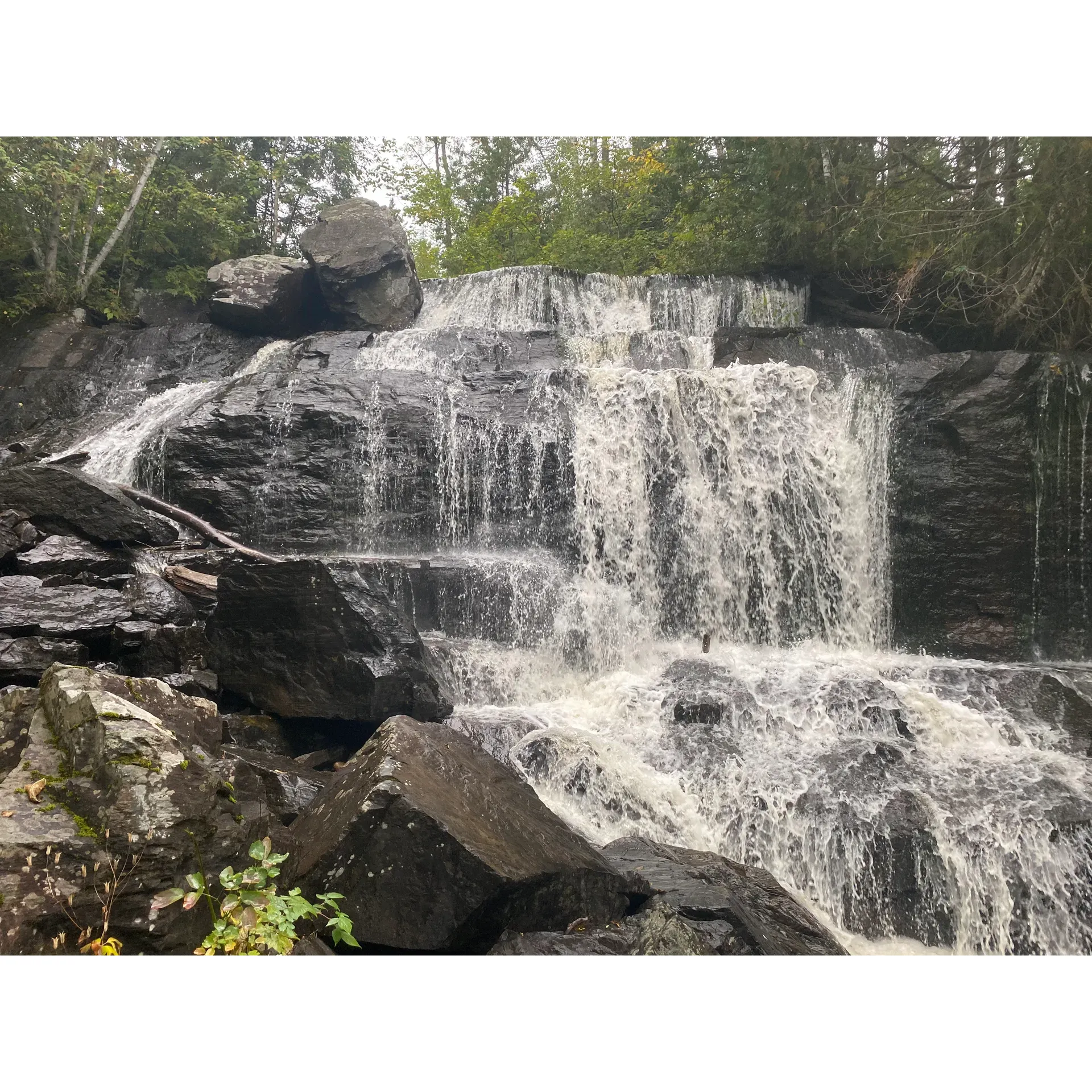 Discover the serene charm of Fountain Falls, a picturesque heritage site located along the tranquil Montreal river. Embrace the opportunity for an up-close encounter with nature's splendor, as the varying water levels can sometimes grant visitors unique access to the falls' base. Immerse yourself in a peaceful environment that is just a stone’s throw away from the main road, providing a convenient yet secluded retreat.

Whether you're journeying through the area or a resident of the tri-town vicinity, make time to experience the unspoiled beauty Fountain Falls has to offer. The falls provide a refreshing stopover with their pristine waters and the calming sound of the cascading flow. Anglers will be delighted by the idyllic setting, which creates a perfect backdrop for a leisurely day of fishing. Engage with nature, rejuvenate your mind, and possibly reel in your next big catch at this enchanting local gem. Description by ChatGPT.