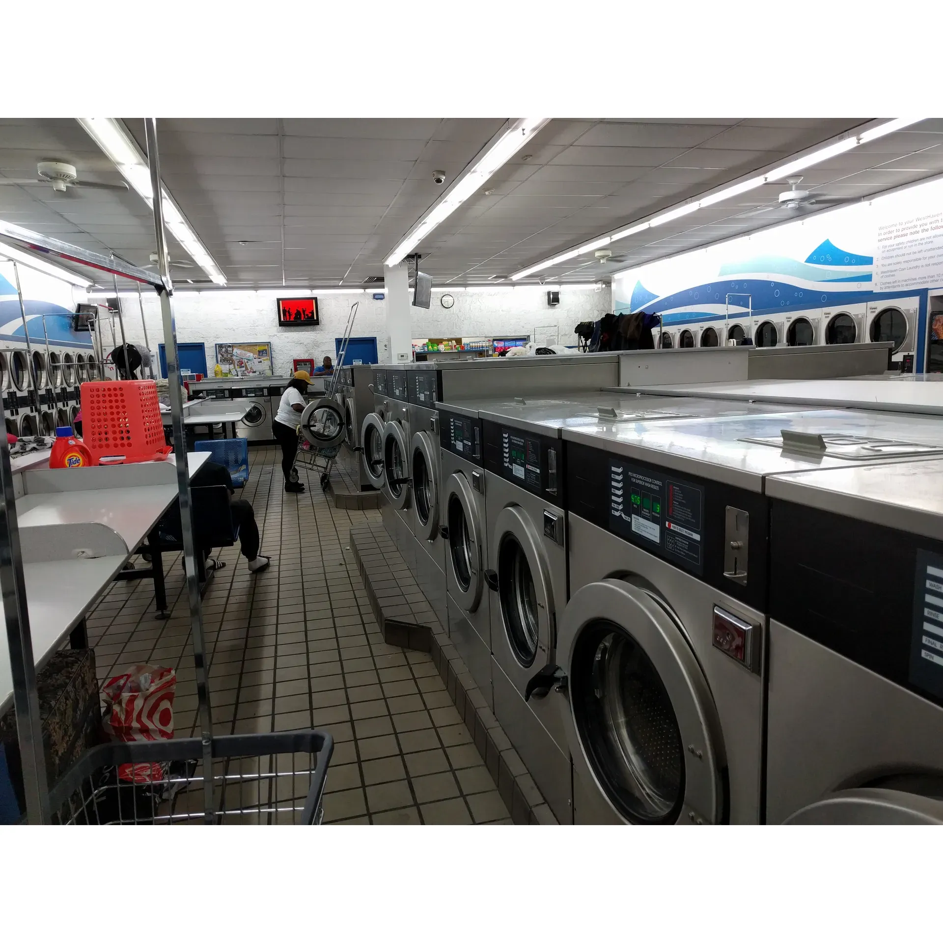 West Haven Coin Laundry is a welcoming establishment offering a comfortable and quiet atmosphere, especially on weekday afternoons. Visitors often praise its cleanliness and the friendliness of its staff. Patrons can enjoy the unique offering of free dryer usage, a service complemented by the support of the helpful attendants who are always willing to assist with the machines or even lend a quarter when needed.

Though the prices for wash cycles may be premium, many customers find value in the convenience and the amenities provided. West Haven Coin Laundry comes equipped with a variety of washer sizes to cater to different laundry loads, from small to large, ensuring that everyone's needs are met. Furthermore, the facility boasts the convenience of on-site change machines, so customers can easily convert cash to quarters for their laundry needs.

Additional conveniences include a retail area offering essential laundry supplies and vending machines for snacks and beverages, making for a more enjoyable and efficient laundry experience. West Haven Coin Laundry also offers the unexpected service of picking up patrons, indicating a commitment to customer care and satisfaction.

With its array of washer options and cost-saving free dryers, West Haven Coin Laundry positions itself as a reliable and service-oriented choice for individuals looking to complete their laundry tasks with ease and efficiency. Description by ChatGPT.