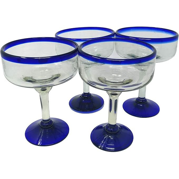 Dos Sueños Mexican Hand Blown Glass offers a set of 4 hand-blown margarita glasses with a beautiful cobalt blue rim. Each glass has a capacity of 16 ounces, perfect for serving your favorite margaritas or other cocktails.