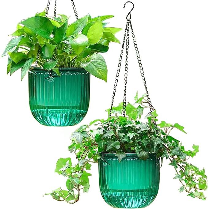 The Melphoe 2 Pack Self Watering Hanging Planters are a set of two 6.5 inch flower pots designed for indoor and outdoor use. They come in a vivid Emerald color, adding a pop of color to any garden or home decor.