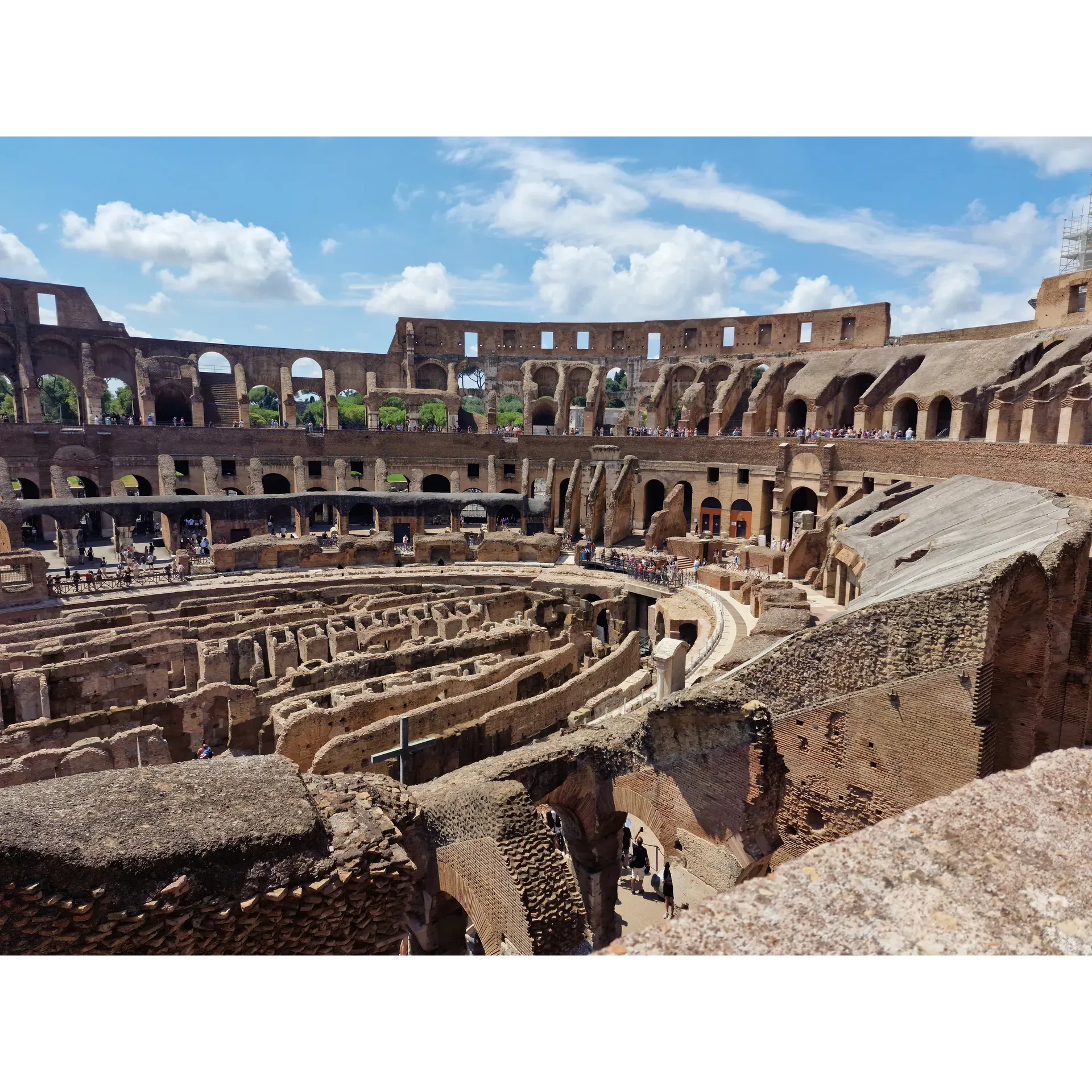 Standing as a monumental testament to ancient Roman engineering and architecture, the Colosseum remains a premier destination for travelers from around the world. A beacon of history and culture, it offers a unique glimpse into the past, allowing visitors to traverse the same grounds where gladiators once dueled for glory and emperors presided over grand spectacles. 

The Colosseum is thoughtfully equipped with modern amenities such as elevators, ensuring accessibility for all guests, including those with walking difficulties. Once inside, patrons are treated to a visual feast, with the arena viewpoint offering a mere hint of the wonders that await. As adventurers make their way to the exit, they're rewarded with even more spectacular views of the Colosseum’s underbelly, where history breathes through the remnants of the underground floor.

Visitors marvel at the Colosseum’s captivating beauty and are immersed in stories of its illustrious past. Each section of the monument delivers a distinct perspective, rich with historical context, making it essential to take time to explore every corner. 

For an enhanced experience, guests are encouraged to engage with the knowledgeable guides available on-site, who bring to life the Colosseum’s fascinating history spanning over centuries. These guides illuminate the past, sharing tales of its construction, illustrious history, and evolution over time. 

Security at the Colosseum is efficient, typically taking guests a mere 20 minutes from queue to entry, ensuring that the journey into antiquity begins swiftly. Visitors often leave with a deep connection to Rome's vibrant history and a sense of the incredible ingenuity of ancient civilizations.

To fully embrace this awe-inspiring venue, travelers are advised to purchase tickets in advance. The grandeur of the Colosseum is a must-see, and those who invest the time to understand its history before arrival are rewarded with the richest experience. Whether standing in awe of its imposing structure or delving into the tales of its storied past, a visit to the Colosseum is a profoundly moving encounter with the heart of Rome. Description by ChatGPT.