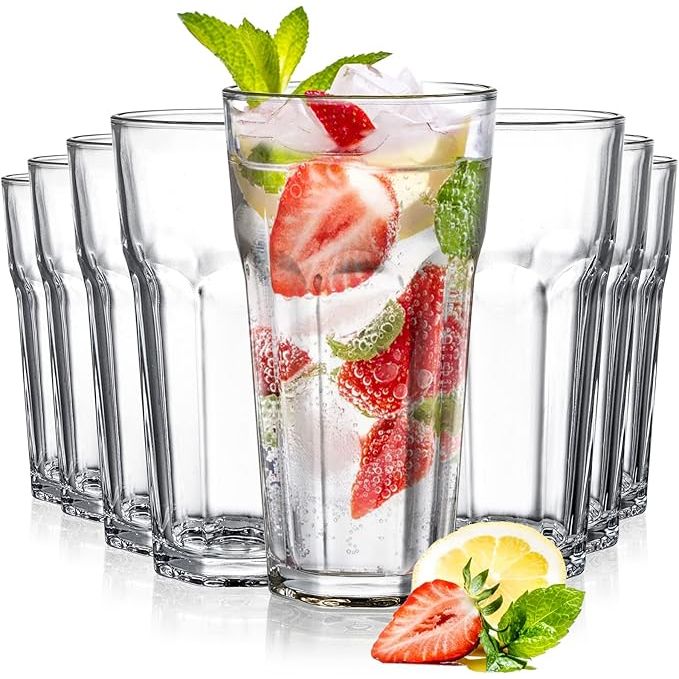 The Yopay Set of 8 Highball Drinking Glasses is a stylish and versatile glassware set perfect for serving a variety of beverages. Each glass has a capacity of 12oz and is made from lead-free tempered glass, making them durable and safe for everyday use. The glasses feature a thick, heavy base for stability and a comfortable grip.