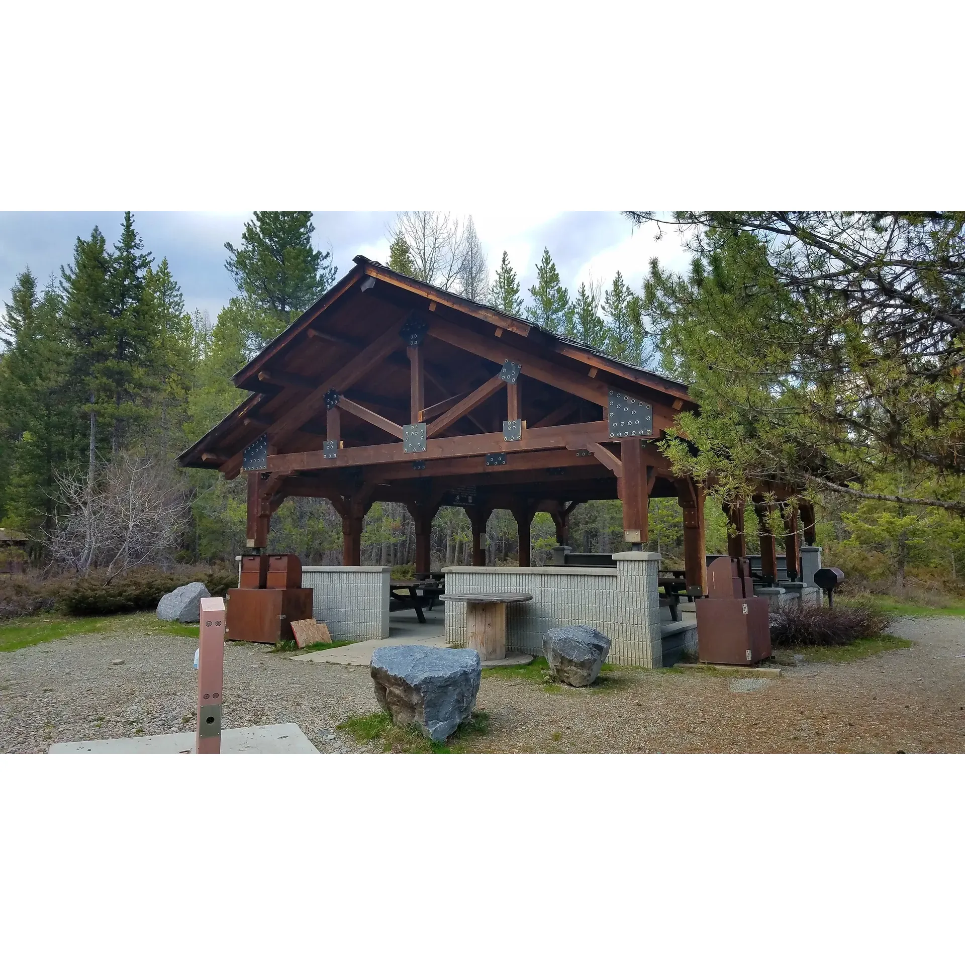 Tally Lake Campground is a serene outdoor paradise offering visitors a peaceful retreat surrounded by the natural splendor of Montana's landscapes. With the second largest lake in Montana as its backdrop, this campground provides a perfect setting for creating lasting memories.

Guests appreciate the tranquility and the easy access to amenities, including abundant restroom facilities and convenient water spigots. Each campsite is equipped with a reasonably sized fire pit for cozy nights under the stars, and the ample bear-proof trash bins keep the campground pristine. At $18 per night, visitors find the value unbeatable.

The staff at Tally Lake Campground receive high praise for their friendly and efficient service, ensuring that guests are well-informed about the fee process and feel welcomed throughout their stay. Campground hosts go the extra mile to maintain the grounds, with their dedication reflected in the cleanliness of the restrooms and the meticulous care of the common areas, such as the boat rental and day-use space.

First-time camp hosts to seasoned visitors share their stories, speaking to the longstanding tradition of quality and care that defines the Tally Lake Campground experience. While the area is popular and highly regarded for its beauty, the community and staff ensure that it remains a tranquil getaway, encouraging guests to declare they will certainly return for another visit.

With the clear, inviting waters of the lake calling for adventurers and the friendly atmosphere cultivated by both management and guests alike, Tally Lake Campground stands out as a premier choice for campers looking for a wonderful, nature-filled retreat. Whether it's for a stay before the season ends or a regular escape into the great outdoors, visitors leave with warm recommendations and a desire to come back to this charming haven. Description by ChatGPT.