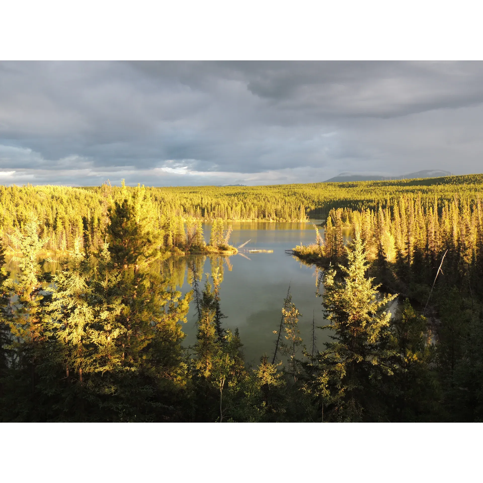 Experience the tranquil beauty of Snafu Lake, an exquisite destination ideal for outdoor enthusiasts and nature lovers alike. Boasting excellent conditions for paddle sports, the lake's calm waters provide an almost windless environment, making it a haven for kayaking or canoeing. Embrace the challenge and excitement of navigating upstream, meandering past industrious beaver dams with ease, and then relax as you glide effortlessly back down with the gentle flow of water.

Snafu Lake is a paradise for angling aficionados; its clear waters teeming with a variety of fish, creating perfect opportunities for both novice and experienced fishermen to indulge in their passion. With a length of 7 to 9 kilometers, the lake offers plenty of room for everyone, maintaining a serene atmosphere even on busier days. Visitors often enjoy peaceful lunch breaks on a charming island located at the lake's far end, providing a picturesque setting to unwind in the heart of nature.

The lake's ecosystem supports a diverse range of wildlife, adding to the enriching experience of all who come to explore its waters and shores. Despite its popularity, Snafu Lake retains an air of seclusion and serenity, ensuring a delightful outdoor adventure for paddlers, anglers, and sightseers. With its crystal-clear waters and scenic surroundings, the lake is a perfect retreat for those looking to escape the bustle of daily life and immerse themselves in the tranquility of the great outdoors. Description by ChatGPT.