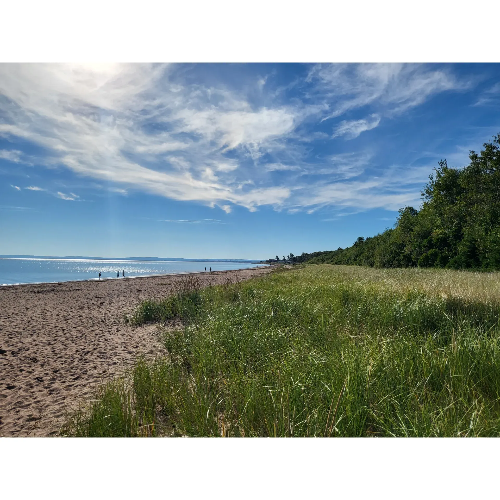 Caribou/Munroes Island Provincial Park is a treasure trove of outdoor bliss, enticing visitors with its easy accessibility and the allure of its tranquil beach. This beloved coastal getaway boasts smooth, soft sands where one can bask in the sun's embrace and revel in the refreshing touch of the ocean waves, albeit a stimulating chill for those brave enough to take the plunge.

Campers delight in the park's top-tier camping facilities, where generous plots like the coveted site 9 in loop A offer electrical hookups and scenic ocean views. The spacious grounds ensure ample room for play and relaxation, all within a whisper's reach of the ocean's melody. Convenience is paramount here, with a dumping station and freshwater supply enhancing the camping experience.

Caribou Park takes pride in its thoughtful accommodations, including an accessible path providing a seamless transition from parking to beach, and an alternative ramp for those requiring a gentle descent to the sea's edge. Visitors appreciate the ample parking and the cleanliness of the area, fostering a serene and welcoming environment.

For those seeking camaraderie and leisure, Caribou offers plentiful green spaces ideal for picnics, complemented by the pristine beach that's just a stroll away. With facilities such as well-maintained outhouses, the Park ensures a comfortable visit for all.

The park's staff is renowned for their kindness, going above and beyond to ensure that guests feel at home. Although the park can be a hub of activity, capturing the joyous energy of summer, it never loses its underlying peaceful charm. Whether it's for an afternoon escape or an extended RV adventure, Caribou/Munroes Island Provincial Park promises a coastal sanctuary where memories are made, and the spirit of summer lives on. Description by ChatGPT.