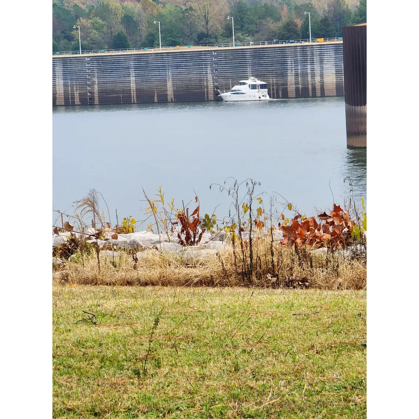 Pickwick Dam Campground emerges as an idyllic haven for outdoor enthusiasts looking to indulge in the simple pleasures of nature. Emphasizing an inviting atmosphere complemented by hospitable and attentive campground hosts, visitors experience exceptional service from the moment of arrival, with every question and need addressed with care.

The pristine cleanliness of the campground sets a standard of excellence, with immaculate bathrooms and handicap accessible showers meeting the needs of all guests. The bathhouses, celebrated for their spotless condition, also offer the luxury of hot water in the sinks— a welcome amenity for campers seeking comfort in the great outdoors.

Camping sites are designed with considerations of space and privacy, providing ample room for relaxation and enjoyment of the peaceful, mostly quiet natural surroundings. The sounds of birds fill the air, adding to the tranquil backdrop that defines the campground.

Anglers and boating aficionados will find the Tennessee River a stone's throw away, with superb fishing opportunities both from the bank and along paths below the dam. The convenience of a public boat launch right across from the campground accentuates the appeal for those drawn to water recreational activities.

RV owners are equally accommodated, with back-in sites thoughtfully crafted to suit their needs. The provision of 50 amp service and water on-site, along with an easily accessible dump station, make for a seamless camping experience that allows for focus on the beauty and stillness of the venue.

The two-day fishing and camping experience at Pickwick Dam Campground is often heralded as a memorable adventure, set against the backdrop of well-kept grounds and a serene environment, where simplicity and quality converge for a relaxing retreat. Whether it’s for a grand occasion like a grandchild’s graduation, a weekend getaway, or a multi-day escape, guests find solace and reprieve in this welcoming outdoor sanctuary. Description by ChatGPT.