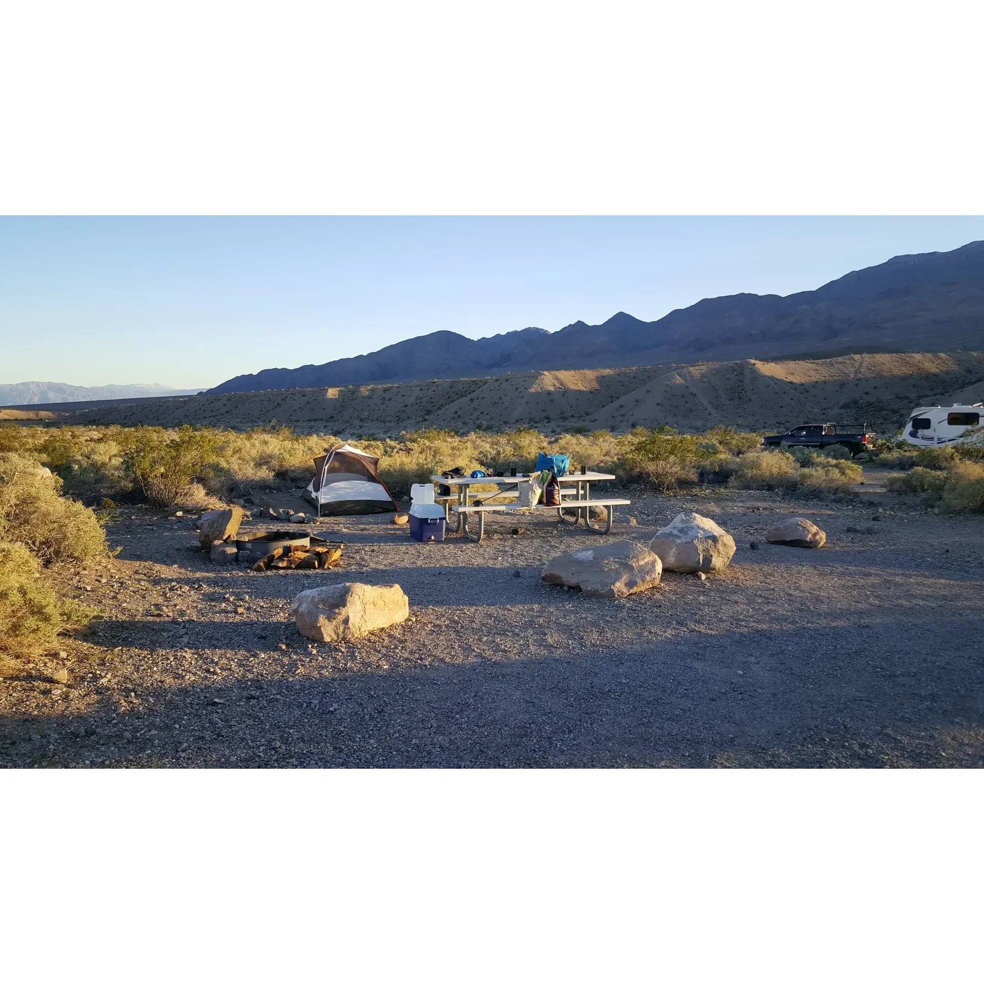 Mesquite Spring Campground offers an unforgettable outdoor experience for those seeking to immerse themselves in the rugged beauty of the desert landscape. Under the radiant glow of a full moon, the vast wilderness becomes a spectacular scene, lit up in the serene light offering a peaceful backdrop to the natural nocturnal soundscape. April visitors enjoy the cooler, breezy nights followed by warm mornings, with the higher elevation providing a gentle respite from the intense midday heat.

Astrophotography enthusiasts and stargazers are drawn to the large, tranquil campsites, away from the distractions of urban light pollution. At this high-desert sanctuary, the night sky reveals a breathtaking tapestry of stars that stretch over the tranquil expanses. With its clean, well-maintained flush toilet facilities, the campground assures a comfortable stay even in its simplicity.

Each campsite provides privacy and ample space to embrace the quietude, accented by the gentle harmony of the natural environment. The 32-mile-long wash starting at the campground offers an opportunity for adventure-seekers to connect with the raw beauty of the environment, while adhering to the respect for nature required by its National Park status. Exploration and geological discoveries are encouraged, with the important caveat to leave the scenery as pristine as one finds it.

The campground is recognized as a cherished destination among visitors who appreciate an "off the grid" atmosphere, as connection to the outside world is limited, amplifying the intimate bond with nature. The friendly camaraderie among campers and the helpful presence of a camp host enhance the sense of a close-knit community. For those on wheels, there's access to a dump station and practical amenities for RV travelers. Although there are no showers on site, the proximity to natural wonders like Ubehebe Crater, coupled with opportunities for stimulating road and mountain biking, ensures a varied outdoor experience full of discovery and adventure.

Arriving late doesn't hinder the ease of settling in, as the campground offers clean restrooms and essential services even into the night, positioning itself as a prime destination for both spontaneous and planned excursions. Mesquite Spring Campground truly is an ideal setting for those looking to connect with the stark majesty of the desert and create lasting memories under its wide, star-filled skies. Description by ChatGPT.