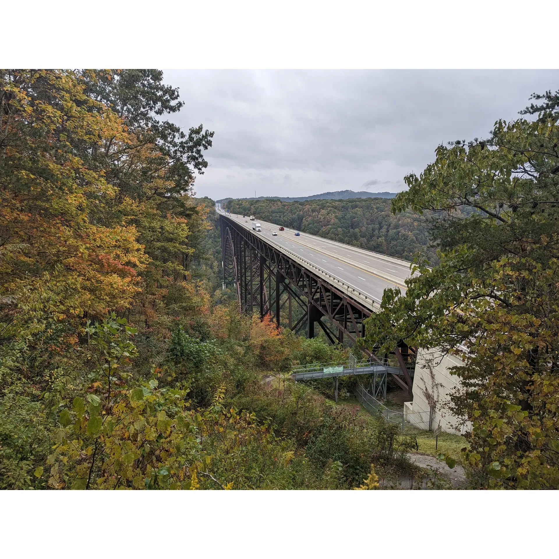 Chestnut Creek Campground is acclaimed for being a picturesque camping destination located within proximity to the heart of New River Gorge, presenting outdoor enthusiasts with an ideal blend of convenience and scenic splendor. This campground is celebrated for its well-maintained facilities, hospitable atmosphere, and the serene yet invigorating natural surroundings that hover just on the brink of adventure.

The campground offers a variety of campsites, ranging from secluded spots to those suited for a convivial gathering of friends. Each site is thoughtfully designed, with certain spaces featuring covered platforms providing a sturdy and flat surface ideal for pitching tents, enhancing the camping experience with an added touch of comfort and practicality.

Chestnut Creek Campground takes pride in the cleanliness of its amenities, including welcoming showers, convenient dishwashing stations, and restrooms that are kept in excellent condition, ensuring that guests can freshen up comfortably after a day full of outdoor exploits. These clean and accessible facilities are often highlighted by visitors as being as commendable as those found in any top-tier campground.

Guests can easily obtain local firewood on-site at reasonable prices, adding to the ease of setting up camp and reveling in the quintessential pastime of gathering around a campfire. The presence of friendly and accommodating staff, ready to assist with arrangements or swiftly respond via channels such as social media, reflects the campground's commitment to providing exceptional service.

For those arriving on spontaneous trips or busy holiday weekends, the attentive staff is known for their resourcefulness in finding great camping spots without prior reservations. The campground's strategic location ensures that guests are merely minutes away from iconic landmarks such as the New River Gorge Bridge, visitor centers, and a plethora of adventure companies offering a variety of thrilling activities.

The spacious distribution of sites allows for ample privacy, creating a tranquil sanctuary where campers can unwind and immerse themselves in nature's tranquility. The approach to the campground, while composed of gravel roads, remains accessible to various types of vehicles, ensuring a smooth arrival to your anticipated retreat in the wilderness.

Chestnut Creek Campground's reputable standing is evident in the continuously good reviews it garners for not just its bucolic charm and prime location, but also for the seamless combination of nature, convenience, and congeniality it offers to all who seek an exceptional camping adventure. Description by ChatGPT.