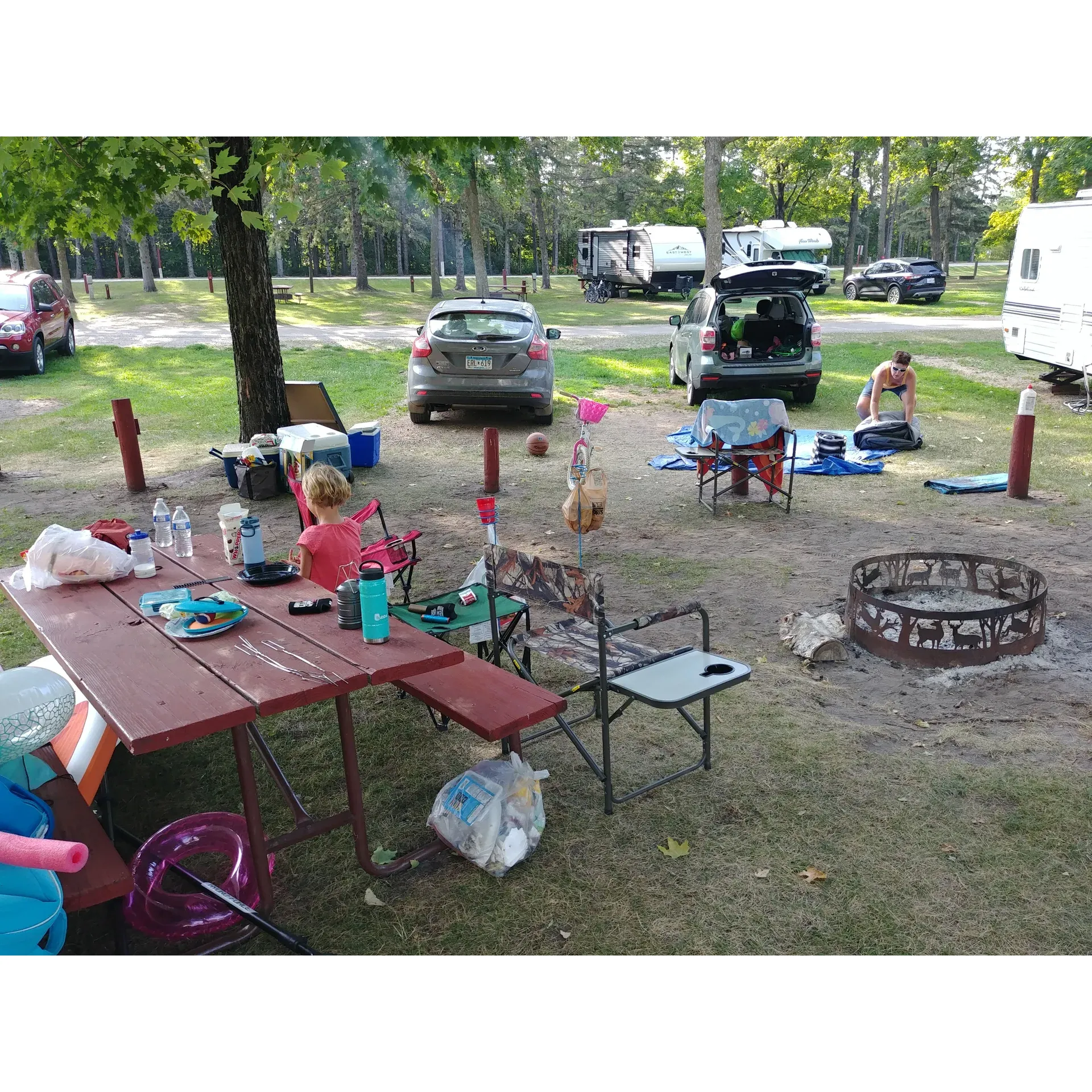 Cedar Lake Memorial Park Campground offers a refreshing blend of outdoor recreation and serene lakeside relaxation. Boasting a beautiful beachfront ideal for families, visitors can enjoy the sandy shores and the crystal-clear waters that provide a perfect setting for swimming. The shallow water extending out from the beach allows for safe and enjoyable wading, making it especially conducive to children’s play.

The park's lake is highly regarded for its cleanliness and is often celebrated as one of the cleanest in Minnesota, ensuring a premium experience for swimmers and snorkelers alike. With an abundance of shade trees dotted along the beach, guests can comfortably relax out of the water while still enjoying the pleasant lakeside ambiance.

Cedar Lake Memorial Park Campground maintains well-kept campsites that complement the natural beauty of the surroundings, ensuring a welcoming environment for families and nature enthusiasts to connect, unwind, and create lasting memories in a family-friendly atmosphere. Description by ChatGPT.