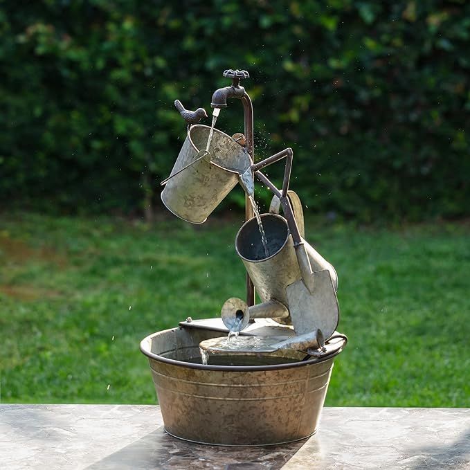 The Alpine Corporation YHL106 Outdoor Floor 3-Tiered Metal Garden Tools Water Fountain is a unique and charming addition to any outdoor space. This fountain features a design that resembles garden tools stacked on top of each other, with water flowing through each tier to create a calming waterfall effect.