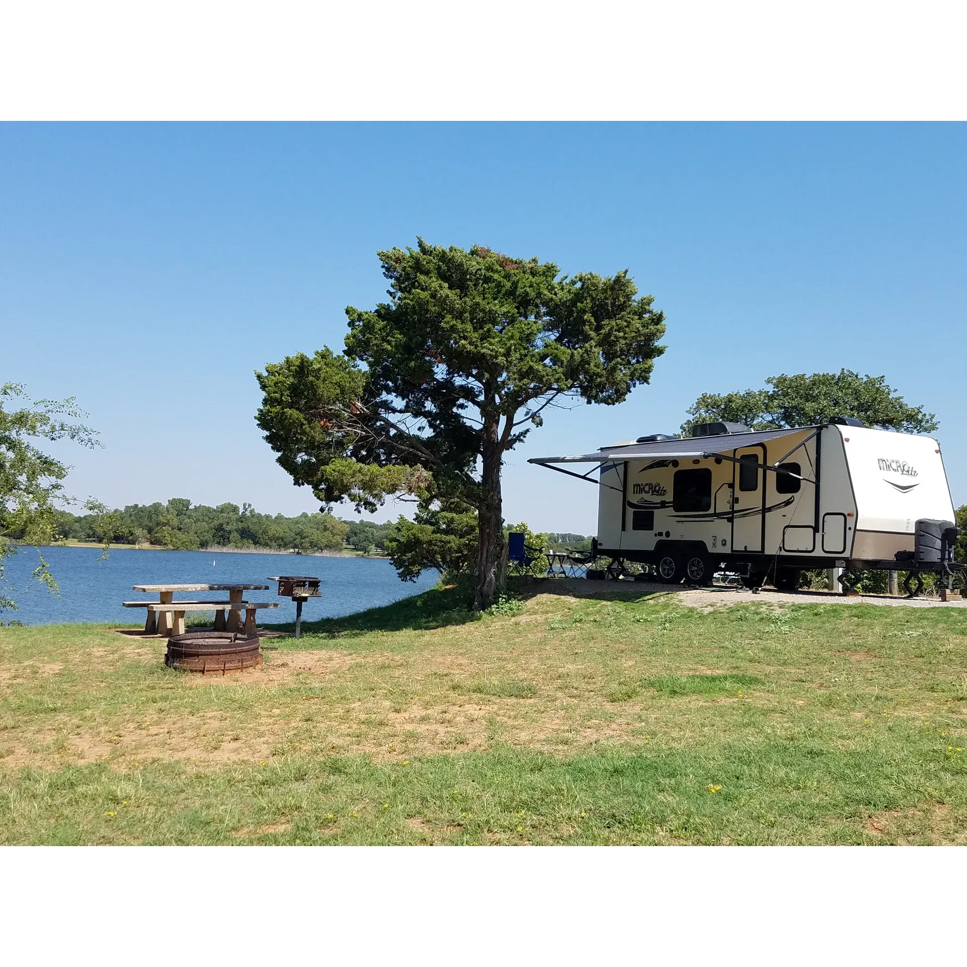 Sunset Cove Campground at Fort Cobb State Park offers an idyllic escape for nature lovers and camping enthusiasts alike. Each perfectly level RV site presents the opportunity for a serene retreat right on the waterfront, providing spectacular views and direct access to the lake's edge. Guests can take comfort in the convenience of nearby well-maintained restroom and shower facilities, ensuring a comfortable and hassle-free stay.

The grounds themselves are meticulously cared for, ensuring a visually pleasing and relaxing environment. Visitors in the winter months are treated to a natural spectacle as the area becomes a congregation point for geese, creating a lively and enchanting atmosphere.

For those seeking tranquility, the campsite promises a quiet and peaceful ambiance, where the daily hustle can be traded for the soothing sounds of nature and the gentle lapping of lake waters. The local vistas are especially stunning, with beautiful views of the lake that can be enjoyed from the comfort of your campsite.

Families will delight in the additional amenities such as a well-equipped playground situated a short walk away, making it an ideal spot for those with children. And whether you're boating or fishing, the friendly marina staff are always on hand to enhance your stay with their exceptional service and local knowledge.

In summary, Sunset Cove Campground is a place where stunning natural beauty meets thoughtful convenience, creating a perfect backdrop for anyone looking to revel in the great outdoors. Description by ChatGPT.