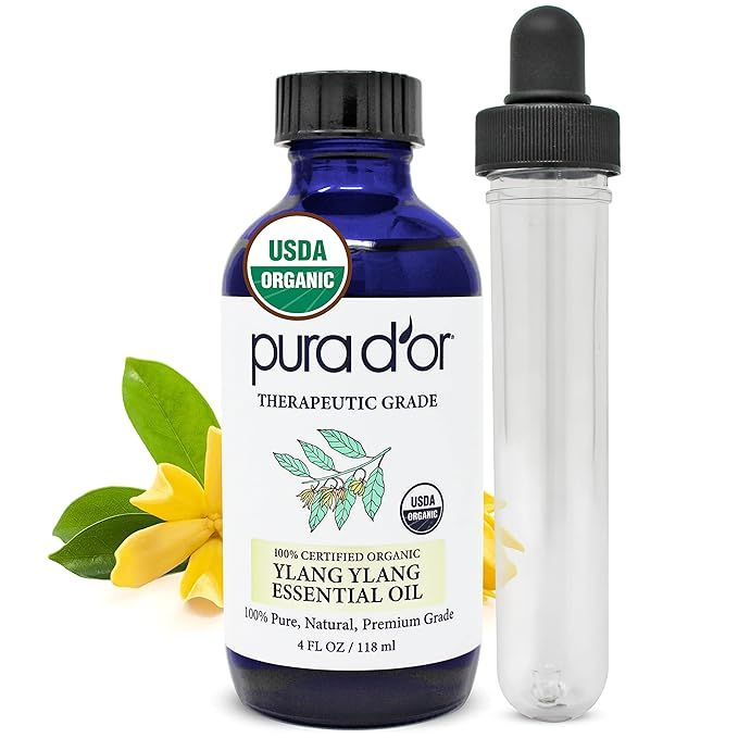 PURA D'OR Organic Ylang Ylang Essential Oil is a 100% pure and natural therapeutic-grade oil. Ylang Ylang oil is known for its calming and uplifting properties, making it a popular choice for aromatherapy and relaxation.