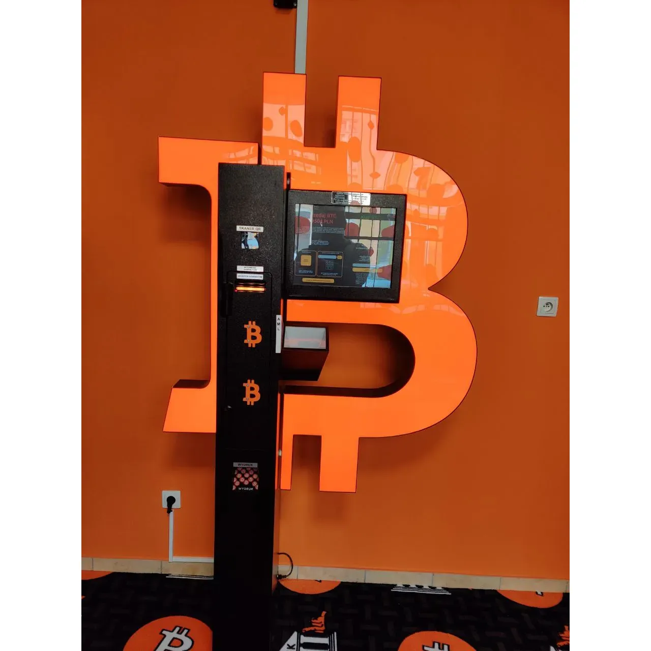 Located in a prime location that is easily accessible to enthusiasts and novices alike, Bitomat - Bitcoin ATM - Shitcoins.club offers a tranquil and inviting environment for individuals looking to engage with the world of cryptocurrency. This Bitcoin ATM provides a seamless and secure transaction experience backed by a sophisticated and user-friendly interface, allowing for both the purchase and sale of popular cryptocurrencies.

Patrons consistently commend the state-of-the-art machine for its reliability and the straightforward process it facilitates, ensuring even those new to digital currencies can confidently navigate their transactions. Beyond its core functionality, the atmosphere surrounding the ATM is serene and welcoming, making it an ideal spot for conducting your digital finance management in peace.

As an extension of Shitcoins.club, this ATM upholds the club's commitment to fostering a community around cryptocurrency and provides a tangible point of contact in the digital age. It’s a sanctuary for those who value the integration of modern financial technology with the comfort of a hassle-free environment. Whether you are there to make a quick transaction or to contemplate your next investment, this ATM stands as a beacon of convenience and tranquility in the bustling realm of cryptocurrency exchanges. Description by ChatGPT.