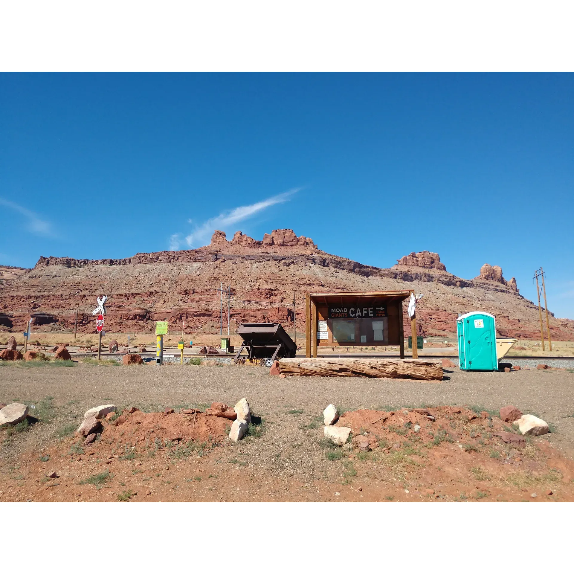 Unlock the secrets of Moab's unparalleled desert landscape at Gemini Bridges Trailhead & Campground, a premier adventure destination that offers an enticing blend of exciting excursions and breathtaking vistas. Boasting a convenient parking lot, the trailhead is the beginning of a thrilling journey that welcomes off-road enthusiasts in vehicles like Jeeps, ATVs, and four-wheel drives to traverse its easy yet adventurous terrain. 

Visitors seeking a more laid-back experience will find the easy hike to the Gemini Bridges a fulfilling endeavor, where the reward lies in the stunning panoramic views that await at the trail's end. The trail's beauty is amplified by the striking backdrop of the red rock formations that are emblematic of Moab's iconic landscape.

Adventurers who conquer the trail are treated to an array of picturesque sights that pepper the route, offering ample opportunities for photography or simply soaking in the brilliance of nature. Those driven by adrenaline will find excitement on the main trail, while the daring can take on the challenge of more difficult side trails, each revealing its own rugged charm.

Exhilarating rides lead to lookouts that offer a glimpse into the historic tales and natural grandeur of the region. These spots provide a chance to stretch one's legs with a hike and discover the majesty of the views both from atop and below – each angle presenting a new way to appreciate the iconic arches and the craftsmanship of time and the elements.

For an ideal day trip or a more extended escape, visitors are also encouraged to explore beyond the Gemini Road toward Highway 313, where more hidden gems of trails and treks lie in wait, ready to be uncovered by those who venture there.

Gemini Bridges Trailhead & Campground encapsulates Moab's essence of adventure and scenic marvels, making it a must-visit for anyone looking to experience the unique thrills and natural wonders of this extraordinary desert region. Description by ChatGPT.