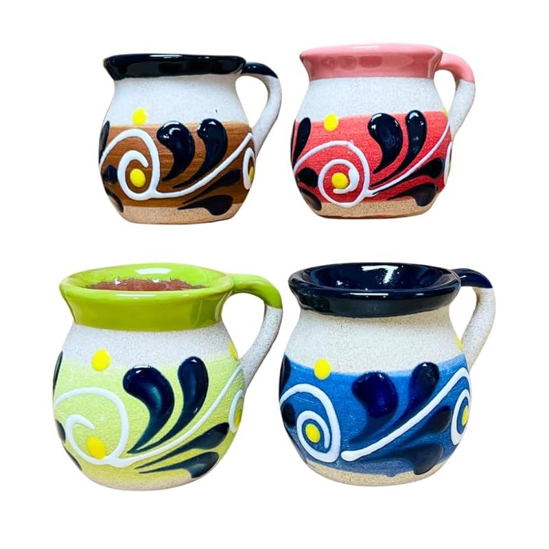 These Set of 4 Engobe Small Mexican Feather Clay Mugs are handmade in Mexico using traditional techniques. Each mug is decorated with intricate feather designs, giving them a unique and authentic Mexican look. The mugs are made from clay and finished with an engobe glaze, making them durable and suitable for everyday use.