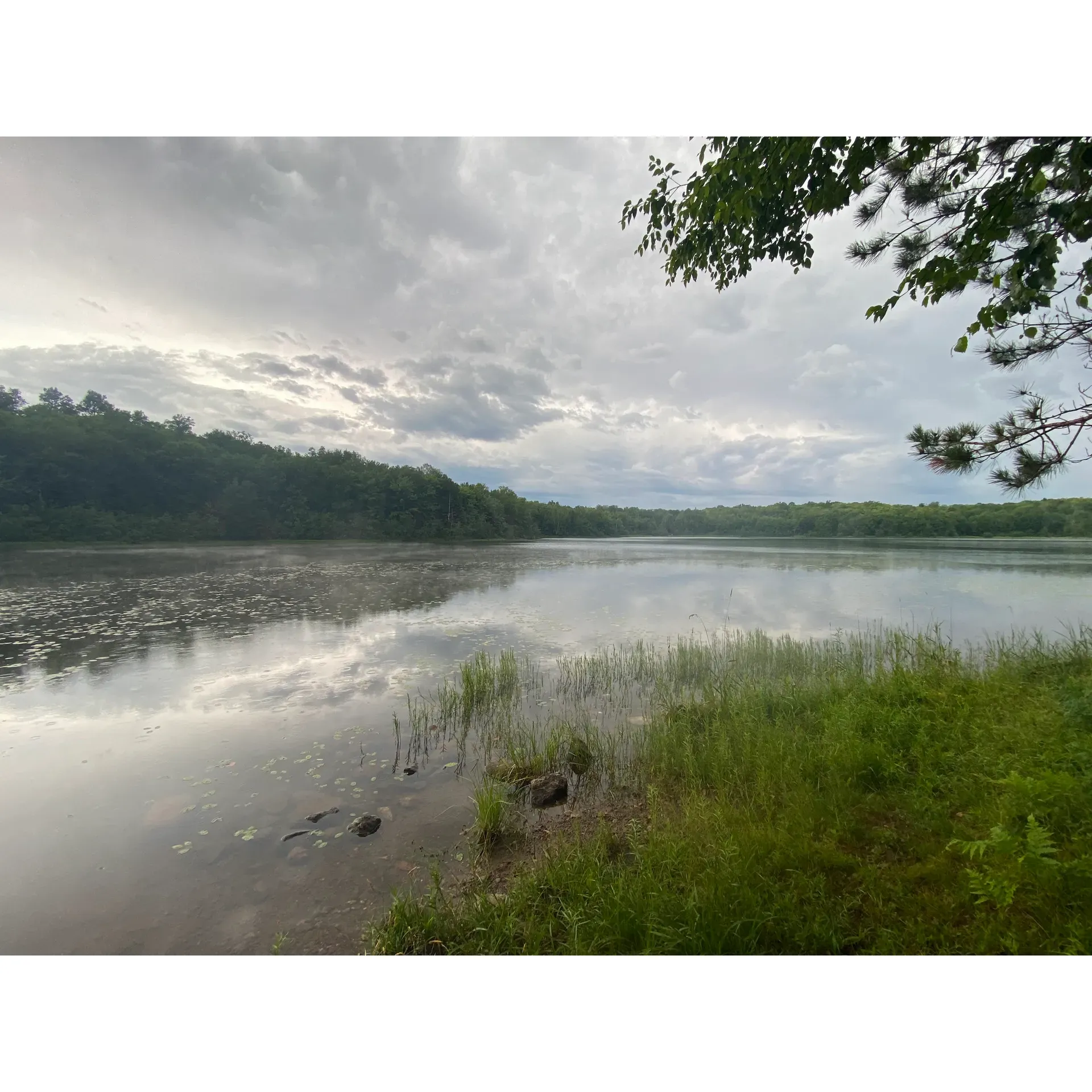 Beaver Lake Campground is an idyllic outdoor retreat perfect for families and nature enthusiasts alike. Its lush environment offers guests the unique opportunity to immerse themselves in the tranquility of the wilderness. Visitors can indulge in an auditory symphony of loons and an abundance of frogs, contributing to the serene atmosphere of the area.

Adventurous campers have the chance to set up their tents on one of the cozy and scenic lakefront sites, ensuring immediate access to the crystal-clear waters of Beaver Lake. Although the campground might not have a traditional sandy beach, the waterfront is inviting and suitable for a refreshing swim. Moreover, if you're fortunate enough to secure a space right by the picturesque lakefront, you can enjoy a private path to the water, a fire ring for memorable campfire experiences, and a level, soft pad for your tent, which makes for a comfortable and serene camping adventure.

This family- and pet-friendly destination welcomes those traveling with little ones and furry companions. It's equipped with a well-maintained gravel access road, ensuring most vehicles can reach the campsite without difficulty. The campsites are tailored to cater to tent campers or those with small trailers, providing simple yet essential facilities such as water pumps and spotlessly maintained vault toilets.

For hiking enthusiasts, Beaver Lake Campground offers an added perk as the North Country National Scenic Trail crosses right by the campground entrance, unlocking access to remarkable landscapes and the serene beauty of nature just footsteps from your campsite. The campground is also situated in close proximity to Copper Falls State Park and offers a scenic short day hike to St. Peter's Dome, among other attractions. 

Despite the remote setting, thoughtful amenities ensure a comfortable stay. Visitors can rest assured there are nice outhouses and hand pumps for drinking water available for a comfortable and rustic outdoor living experience. The campground's emphasis on conservation and sustainability is reflected in the practice of packing out what you bring in to help preserve the natural beauty of the area. 

Beaver Lake Campground is an enchanting destination offering a harmonious blend of natural beauty, outdoor recreation, and peacefulness, perfect for those seeking a rustic escape in the embrace of nature's splendor. Description by ChatGPT.