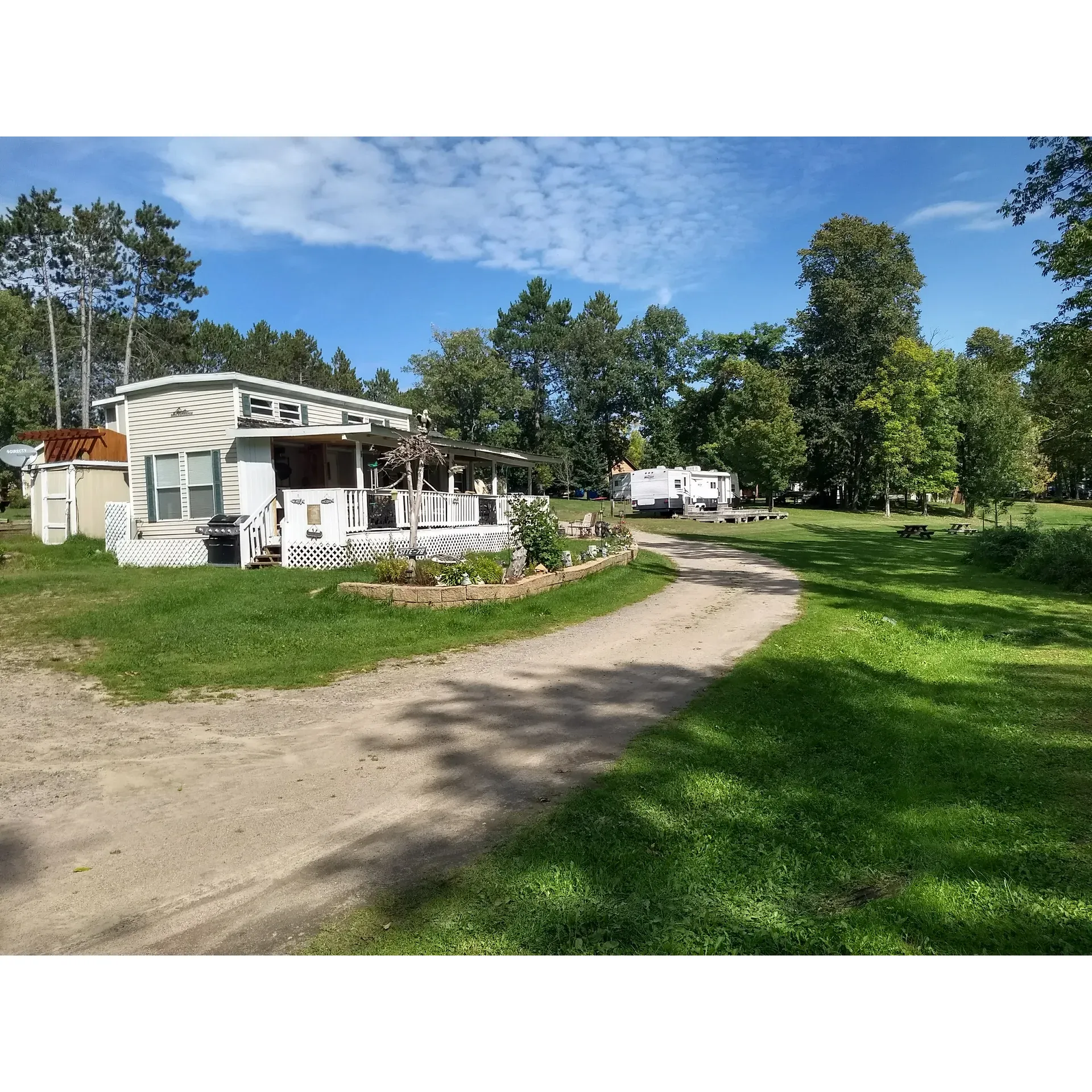 Prairie Lake Campground LLC is a charming family-run retreat that offers a serene lakeside getaway near Grand Rapids, MN. With its scenic location on Prairie Lake, the campground serves as an ideal destination for both relaxation and outdoor adventures. The establishment boasts a range of camping options, featuring full and partial hookups to cater to varied preferences and needs.

The campground is well-regarded for its immaculate facilities, with guests consistently praising the cleanliness and upkeep of the restrooms and separate shower areas. The friendly owners enhance the experience, ensuring a warm and welcoming atmosphere that resonates with visitors of all ages. Additionally, the on-site store is a delightful convenience, stocked with essentials and more, adding to the ease and comfort of your stay.

Anglers will find themselves in paradise with the good fishing opportunities that Prairie Lake offers, while the campsites are meticulously maintained and designed to provide a perfect blend of accessibility and privacy. For families, the campground doesn't disappoint, providing a family-oriented environment complete with a sandy beach, a designated swimming area, and an array of natural foliage and wildlife that invites exploration and appreciation.

Customer service at Prairie Lake Campground LLC goes above and beyond, with the accommodating staff ready to welcome guests even without reservations, ensuring everyone finds a suitable and serene spot to enjoy, such as the secluded gem (3B). This commitment to care and attention to detail has left many visitors wishing they could book their next year's stay in advance - a testament to the memorable experiences crafted at this idyllic lakeside campground. Description by ChatGPT.