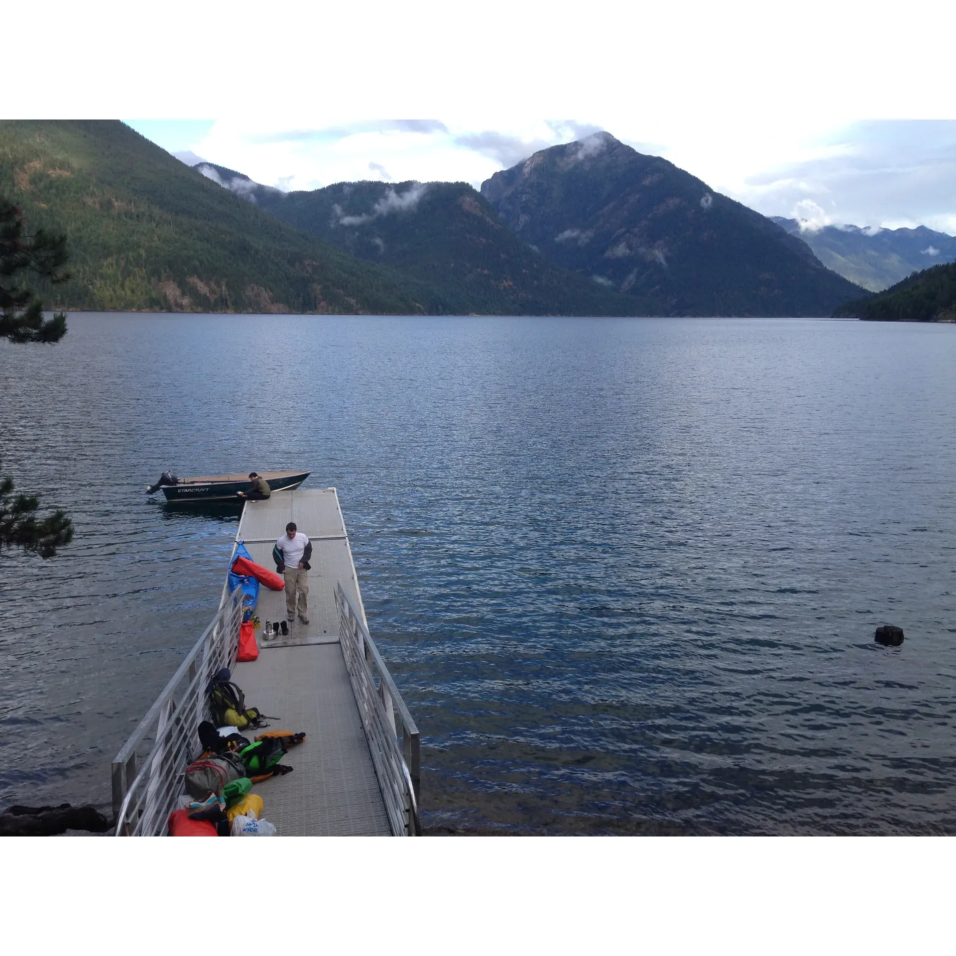 Cat Island Campground on Ross Lake is the ultimate sanctuary for outdoor enthusiasts craving a tranquil retreat in the heart of nature. Surrounded by the majestic scenery of the North Cascades and the iconic presence of Mt. Baker, this picturesque setting offers a spectacular backdrop for campers looking to immerse themselves in beauty and tranquility. 

With no cell service, visitors can disconnect from the world and reconnect with themselves, enjoying undisturbed sleep and the simple pleasures of the wilderness. Anglers and wildlife watchers will revel in the abundance of fish and fauna that call this area home, while hikers can explore a variety of trails, including access to nearby attractions like Desolation, Lightning Creek, and Little Beaver.

Cat Island is a much sought-after destination for those wanting a genuine escape from the hustle and bustle of everyday life. Early reservations are recommended to secure a spot in this coveted getaway. Although the journey up the lake may be lengthy, the rewards of unparalleled beauty and proximity to pristine wilderness are worth the venture.

Campers can enjoy well-maintained sites ideal for pitching a tent and soaking up the serenity. As a reminder for those headed to this remote paradise, bring water, and prepare for the playful local wildlife, which may include the resident squirrels, who are known for their cheeky curiosity.

At Cat Island Campground, you will find a piece of untouched paradise waiting to provide the perfect setting for your next camping adventure. Here, discover the true essence of a perfect getaway, enveloped by the peace of nature and the splendor of the great outdoors. Description by ChatGPT.