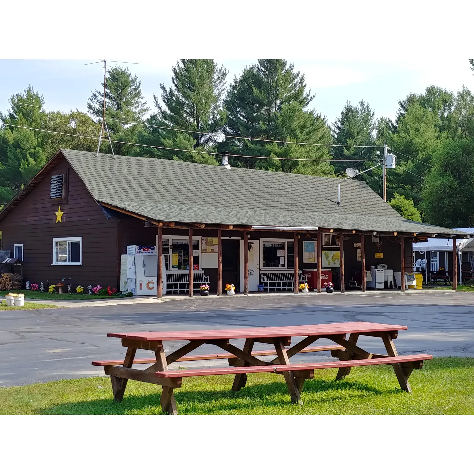 Happy Horseshoe Campground is a serene and spacious retreat perfect for camping enthusiasts seeking a blend of relaxation and community spirit. With friendly and approachable hosts, Buster and Judy at the helm, the campground boasts an inviting atmosphere where seasoned campers and newcomers alike are welcomed into the fold. Visitors frequently commend the well-maintained pool, recreational hall, and children's play area, ensuring that guests of all ages have delightful amenities at their fingertips. 

The carefully curated mini-store makes for a convenient shopping experience, providing essentials without needing to leave the comfort of the campground. Weekends come alive with well-loved traditions, including the highly praised Saturday night baked bean supper—a must-try experience for both culinary adventurers and those who appreciate the comforts of home-cooked meals. 

Families are particularly fond of Happy Horseshoe, noting its strong child-friendly orientation. Parents can relax as their children engage with numerous events and activities tailored for the younger crowd, including access to ATV trails, a fun arcade, and an expansive playground perfect for energetic exploration. The campground's aesthetic charm is heightened by whimsical wooden decorations featuring black bears and moose, creating an enchanting setting that appeals to nature lovers and outdoor enthusiasts.

Social events and gatherings are the heartbeat of this community-centric campground. With lively entertainment on holiday weekends, including dances, auctions, and visiting bands, there's never a dull moment. Additionally, local clubs contribute to the vibrant social scene with activities such as chicken BBQs hosted by the local snowmobile club.

Campers seeking a quieter scene will appreciate the tranquil environment, where even the livelier nights wind down by nine o'clock, respecting the peaceful ambiance. The grounds are praised for their level, spacious sites, offering a comfortable and private camping experience amidst the pines. Although most sites offer only electric and water hookups, convenient dump stations and affordable service options make it easy for both short-term and long-term guests to manage without any hassle.

For those looking to make Happy Horseshoe their seasonal go-to destination, competitive pricing and the value of the amenities offered make it an attractive option. Returning guests often speak of forming lasting friendships within this warm-hearted camping community, further enhancing the appeal of this outdoor haven.

In essence, Happy Horseshoe Campground is an idyllic slice of paradise for campers looking for a friendly, eventful, and picturesque place to pitch their tents or park their RVs. With a plethora of activities, comforts, and a welcoming community, it truly stands out as a premier choice for creating memories that last a lifetime. Description by ChatGPT.